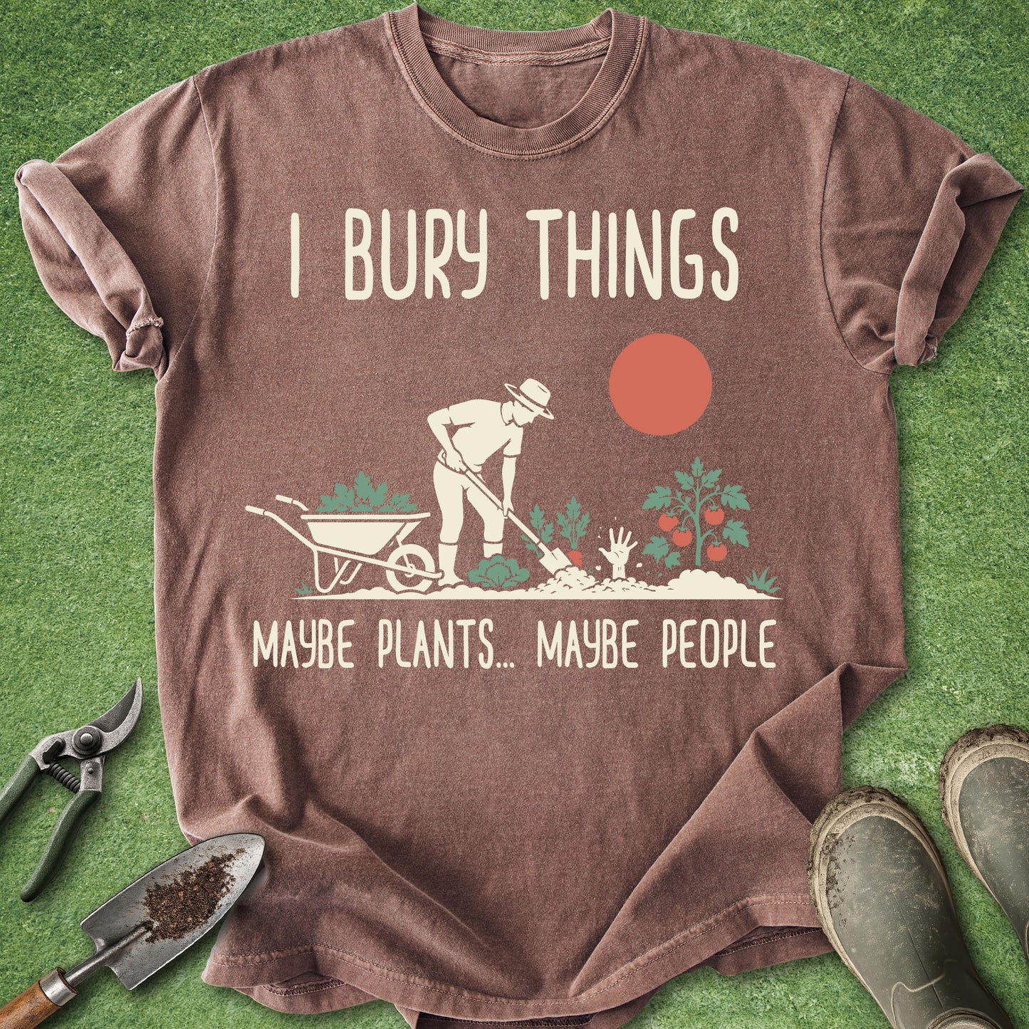 Funny gardening t-shirt with retro gardener illustration and “I Bury Things Maybe Plants Maybe People” text on brown shirt