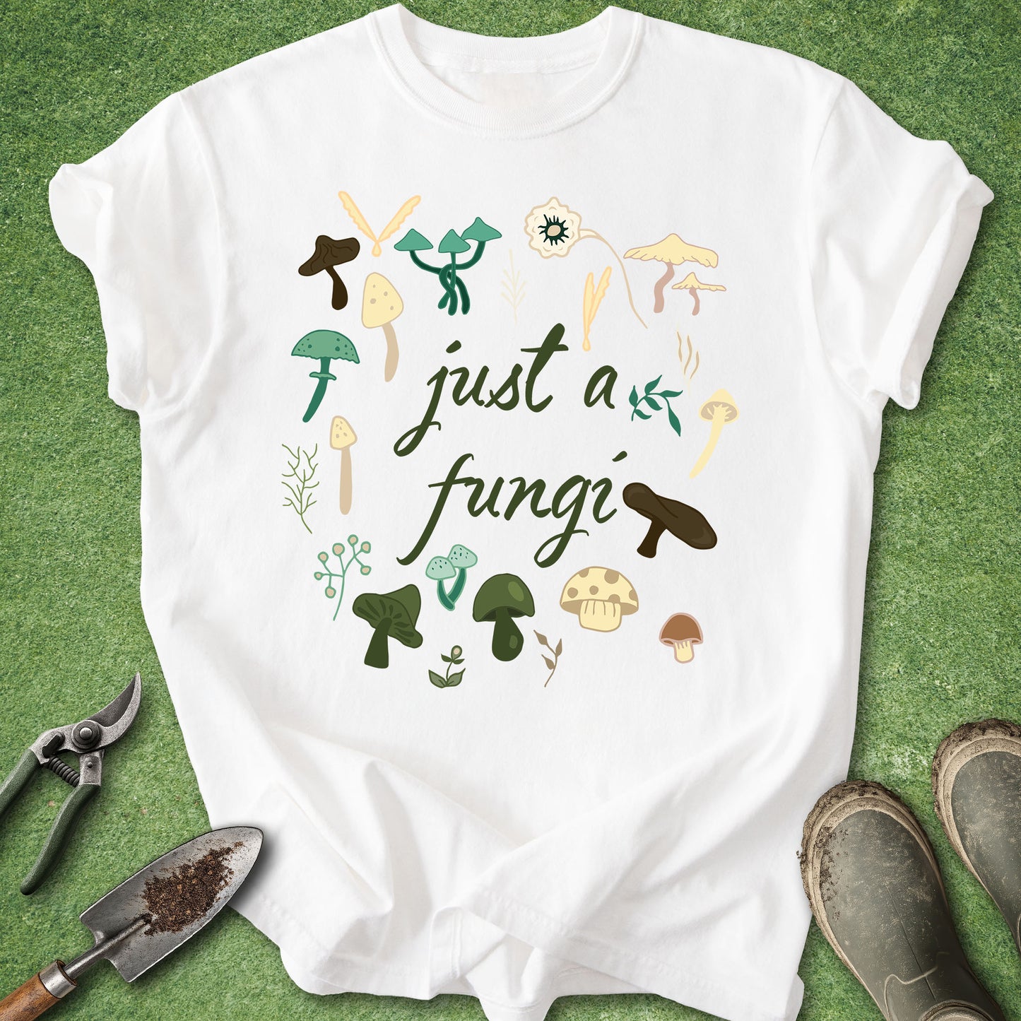 White t-shirt with mushroom design and text 'just a fungi' on a green background