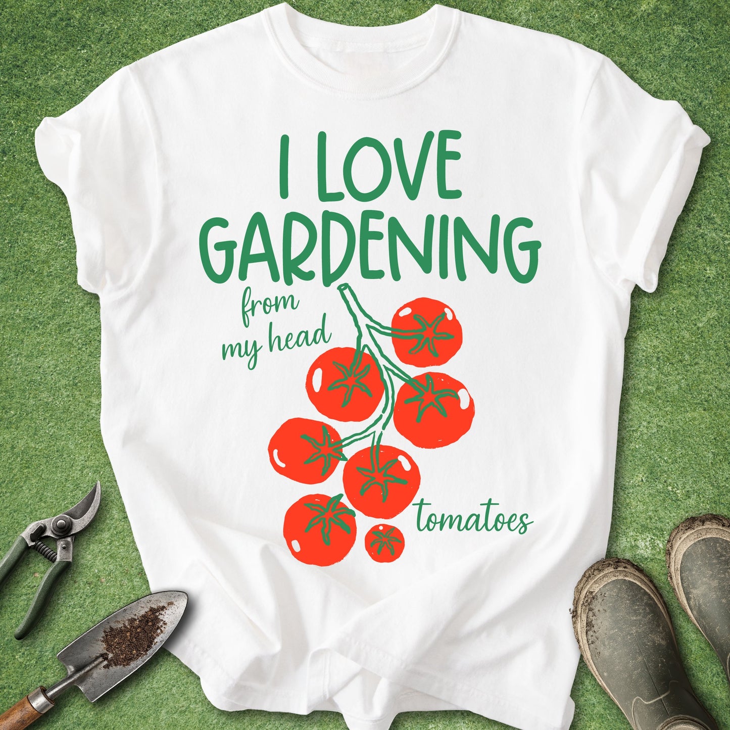 White t-shirt with 'I love gardening from my head tomatoes' text and tomato graphics on a green background.