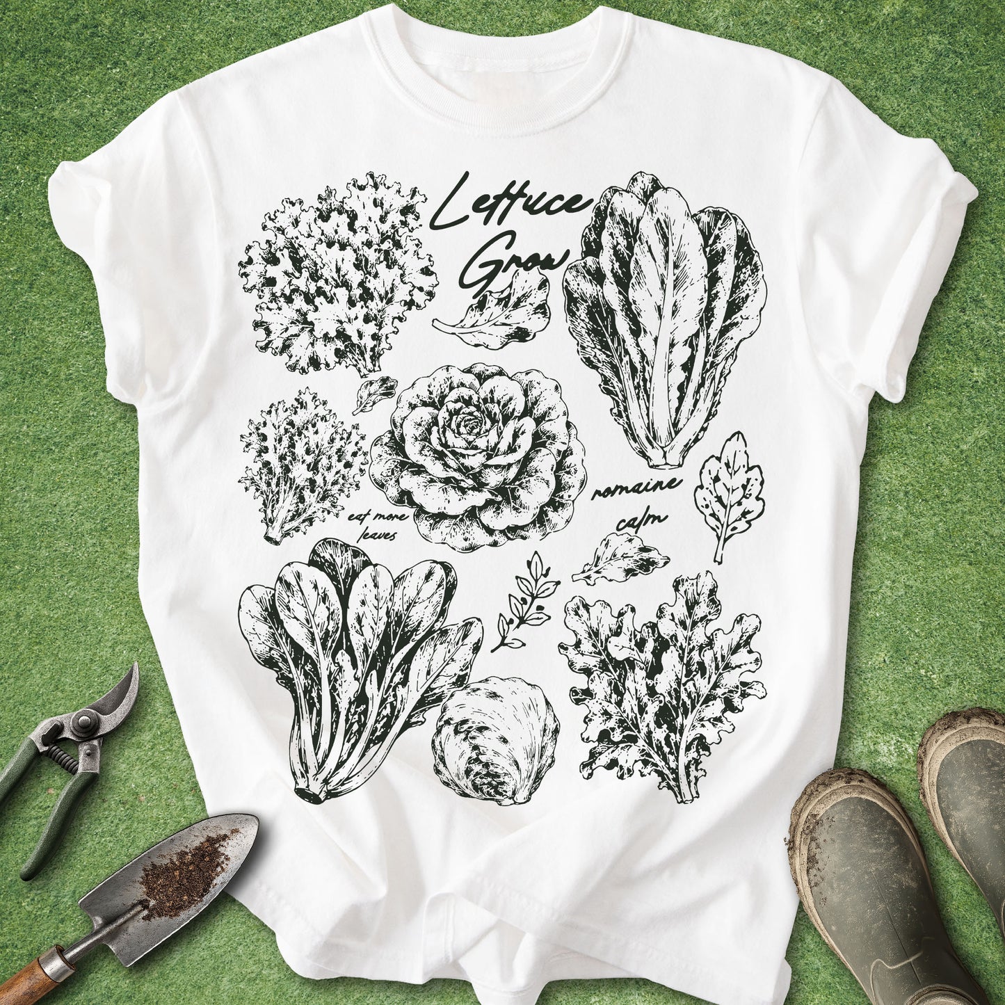 White t-shirt with black vegetable illustrations on a green background