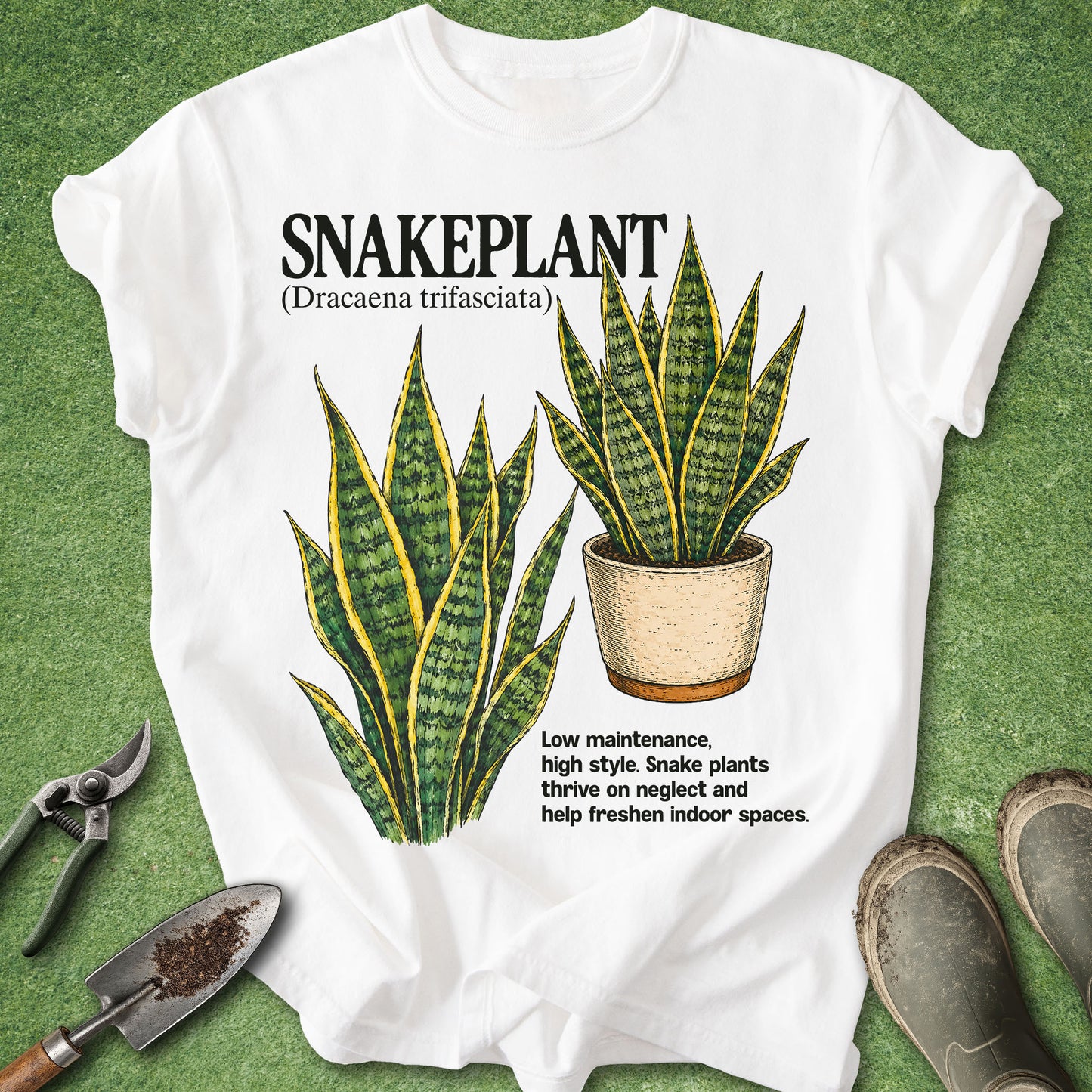 White t-shirt with snake plant graphic and text on a green background