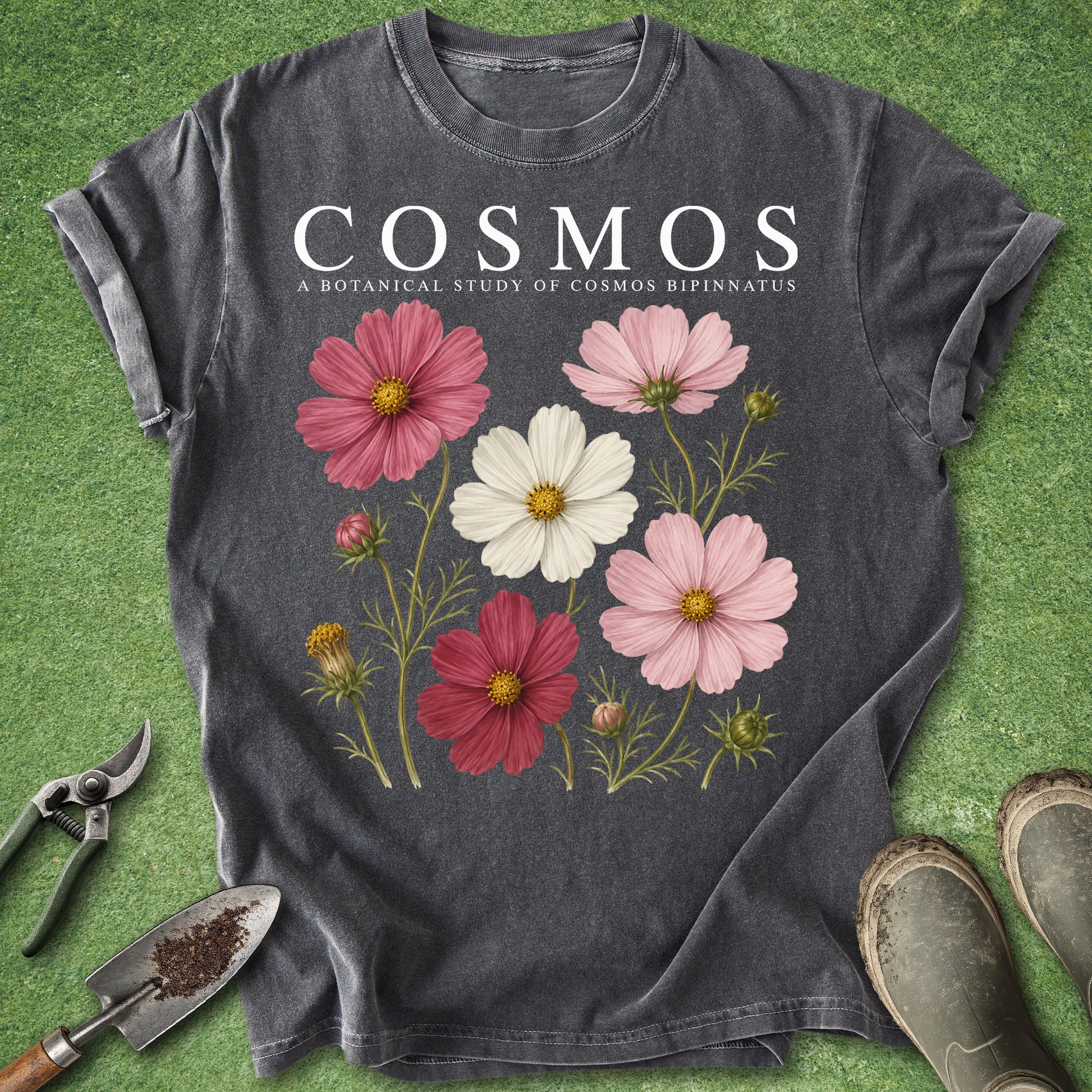 Dark gray t-shirt featuring a botanical study of pink, red and white Cosmos bipinnatus flowers with green stems, foliage and buds.