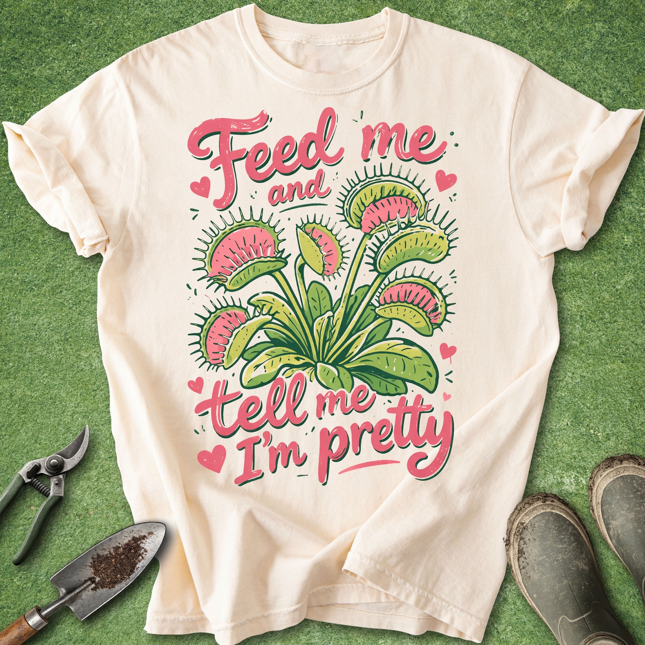 Beige t-shirt with floral design and text on a green background