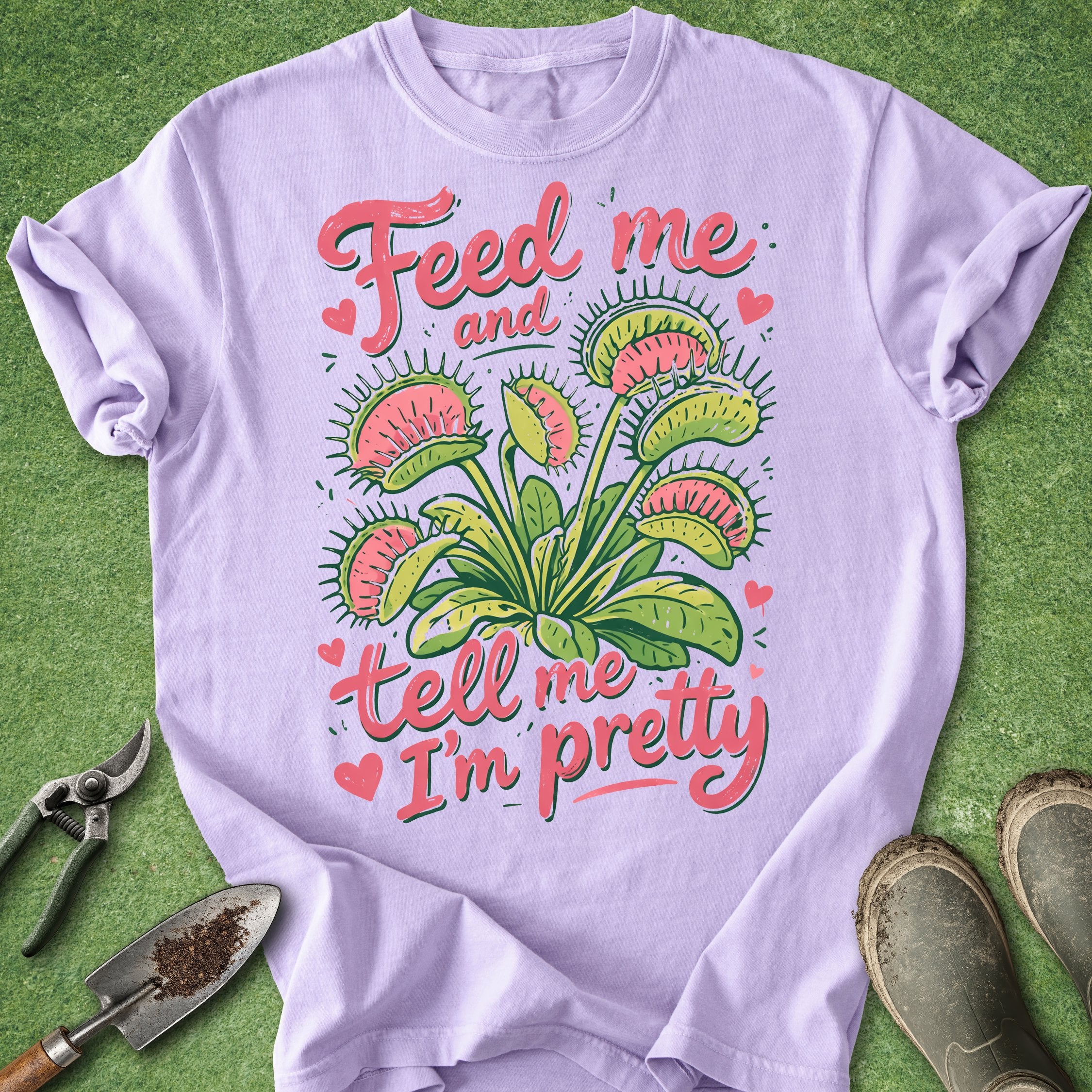 Lavender t-shirt with Venus flytrap graphic and text on a green background