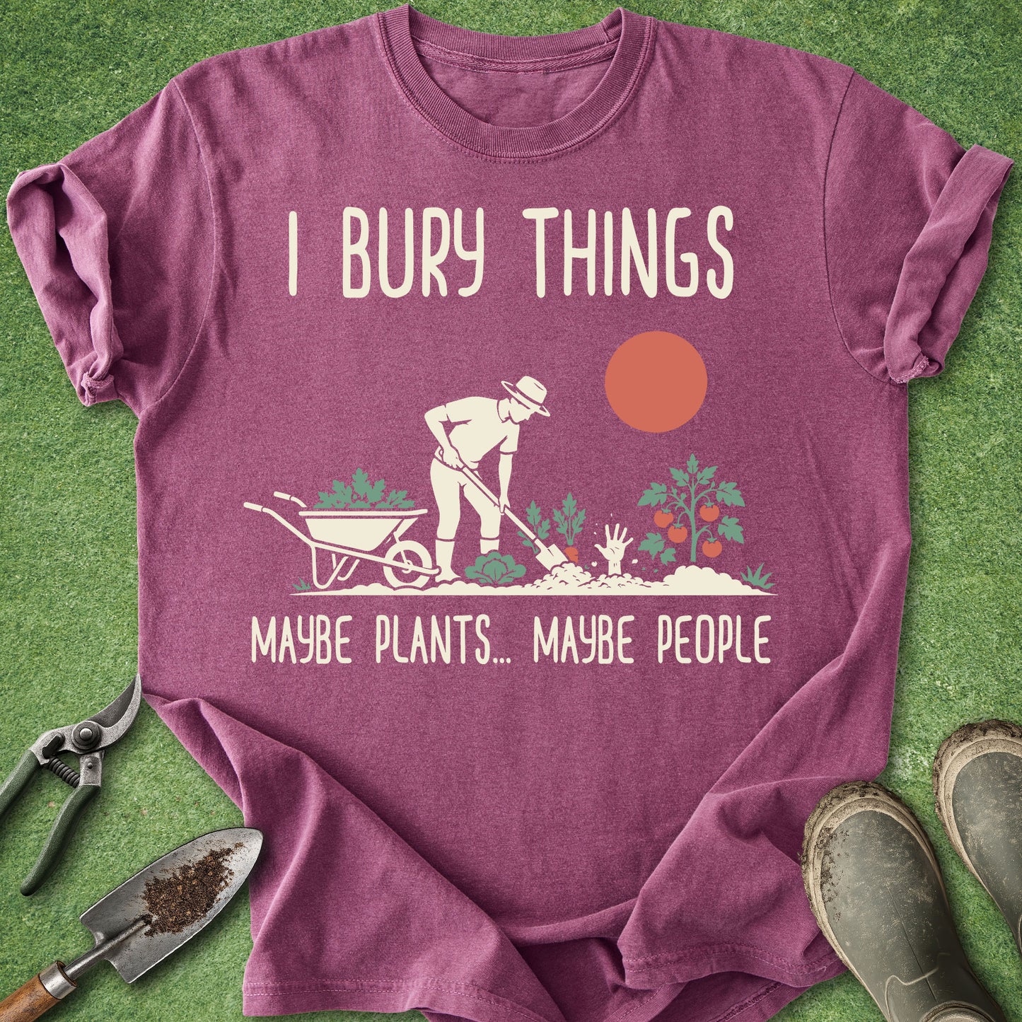 Purple t-shirt with gardening graphic and text on a grass background