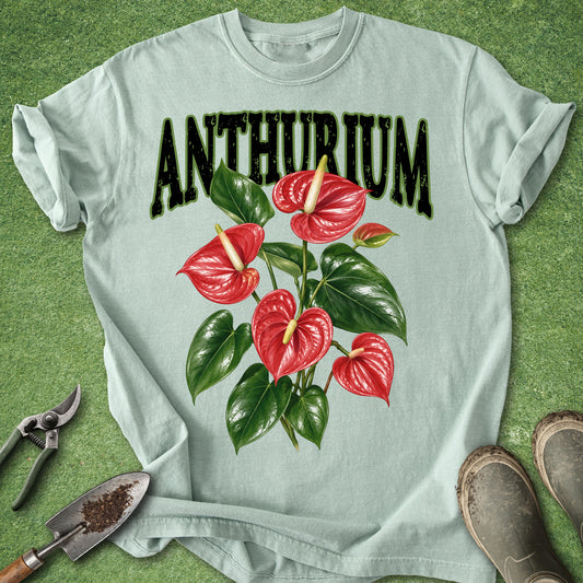 Light green t-shirt featuring red Anthurium flowers, glossy green leaves and large vintage-style Anthurium lettering.