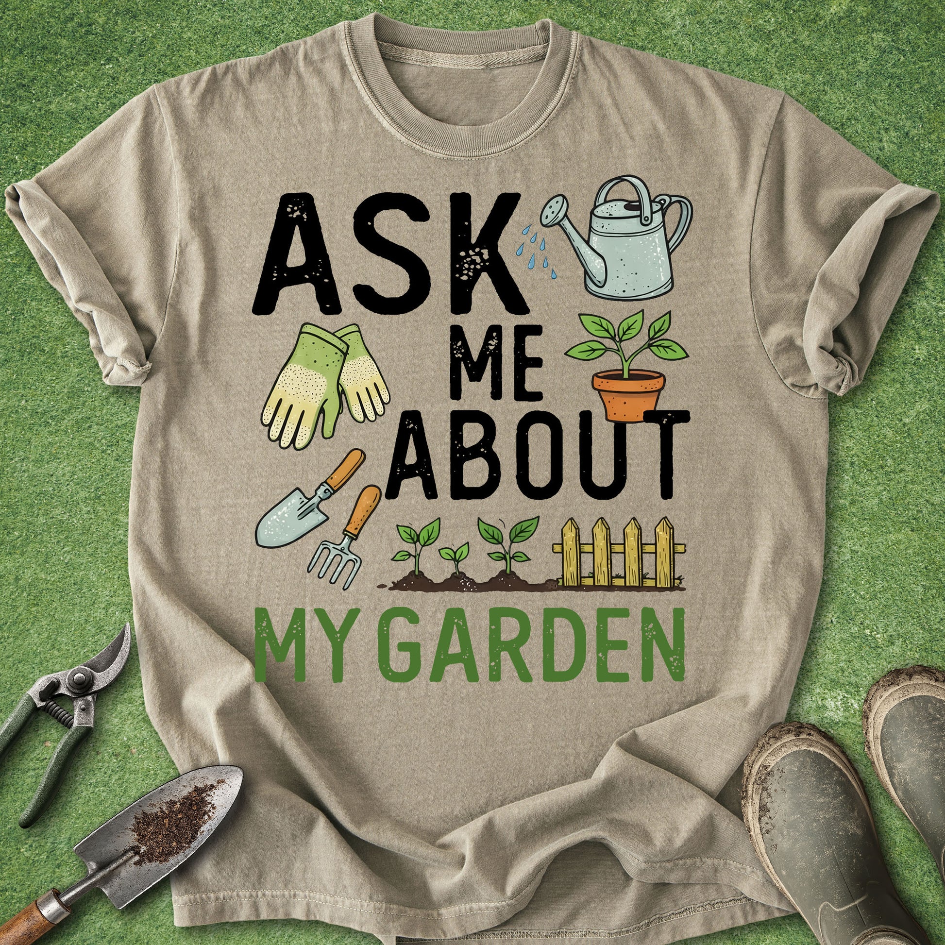 Beige t-shirt with gardening-themed text and graphics on a green grass background