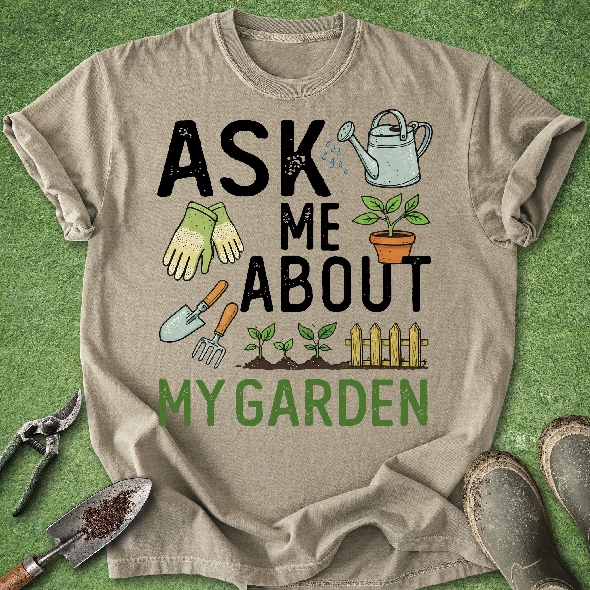 Beige t-shirt with gardening-themed text and graphics on a green grass background