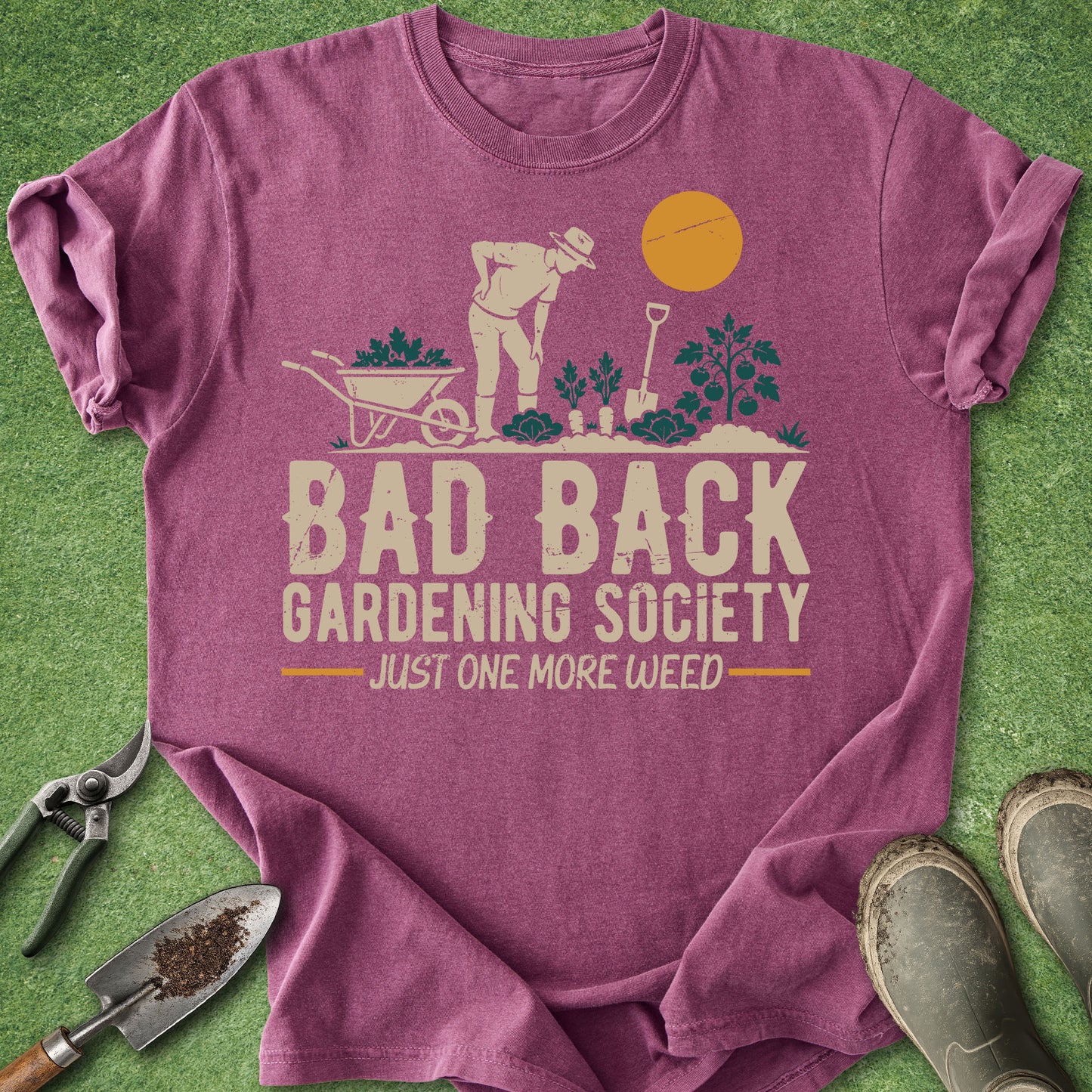 Purple t-shirt with gardening graphic and text on a grass background