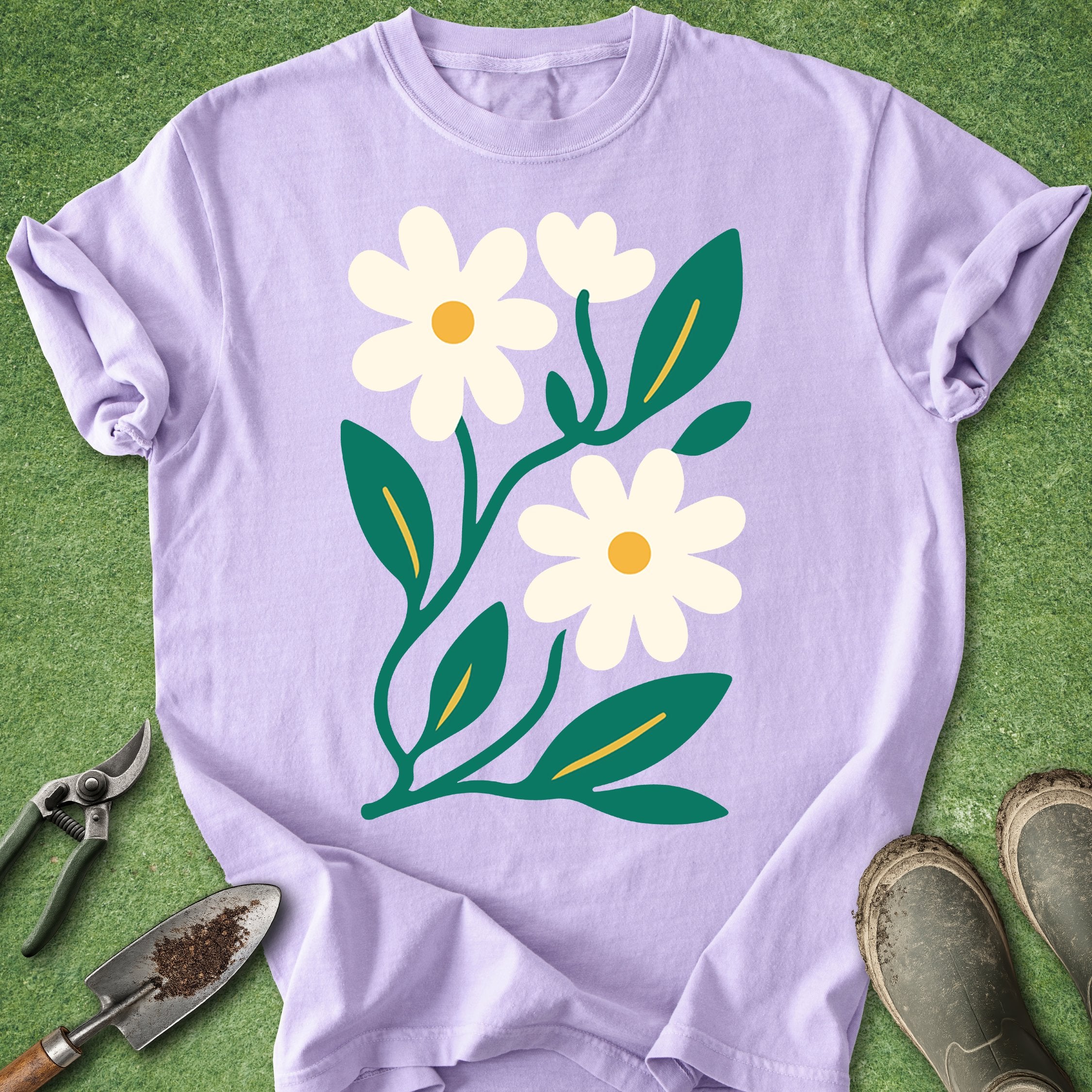 Purple t-shirt with white flowers and green leaves on a green background