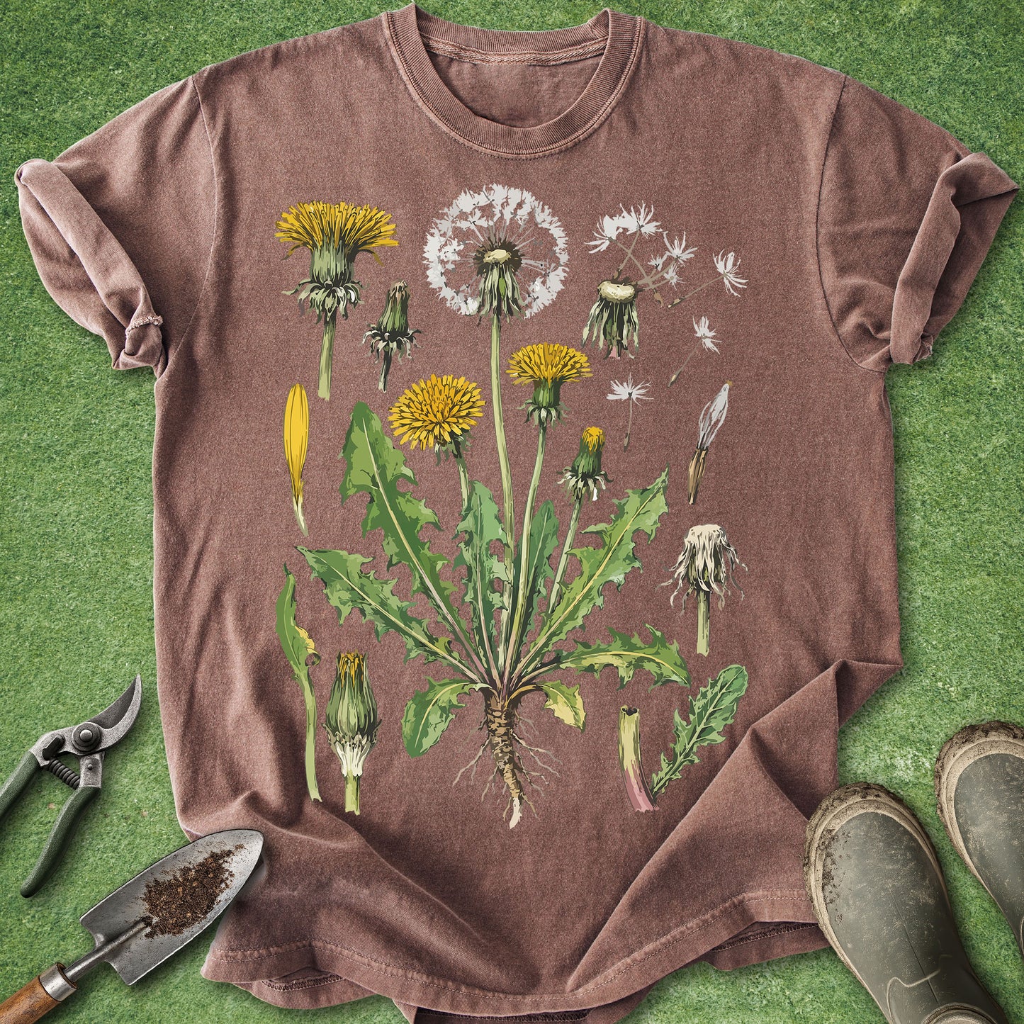 Brown t-shirt with dandelion graphic on a green grass background