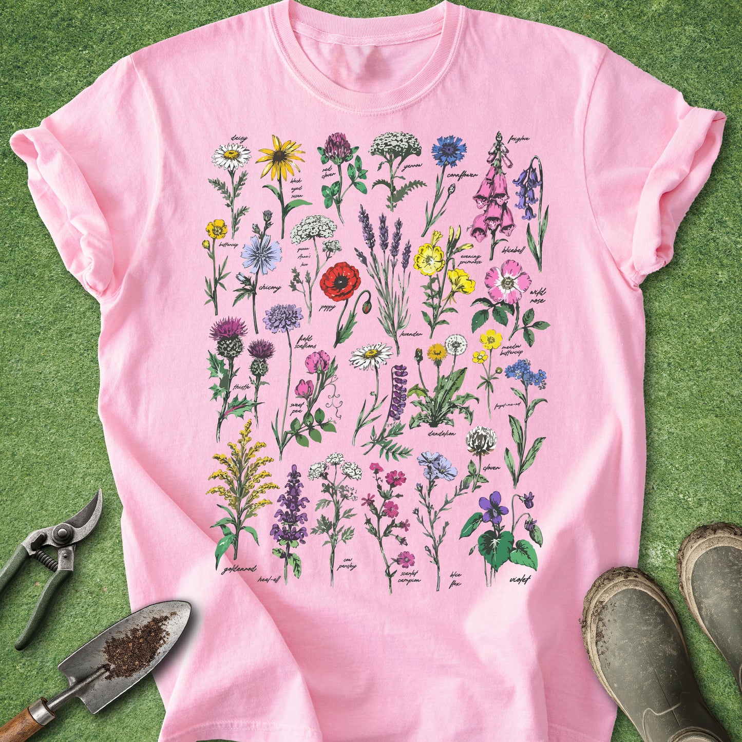 Pink t-shirt with floral design on a green background