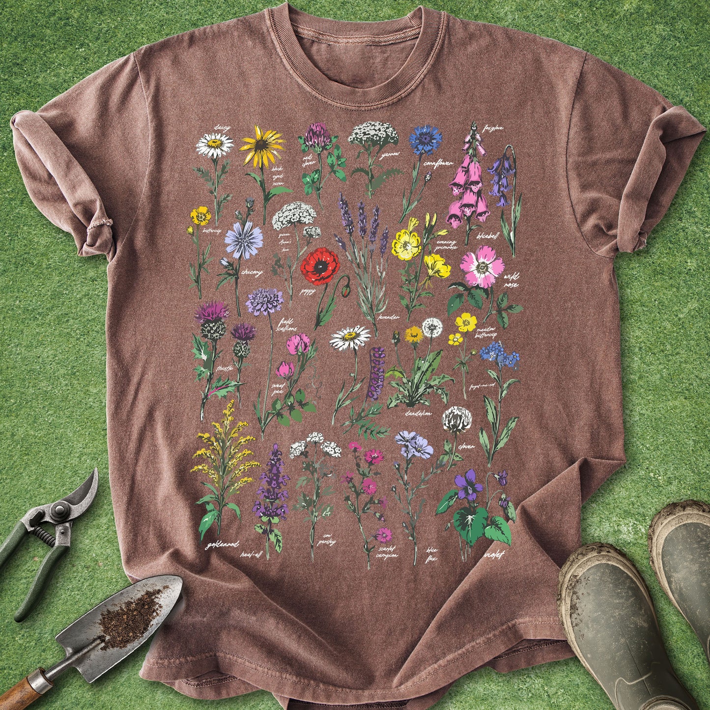 Brown t-shirt with floral designs on a grass background