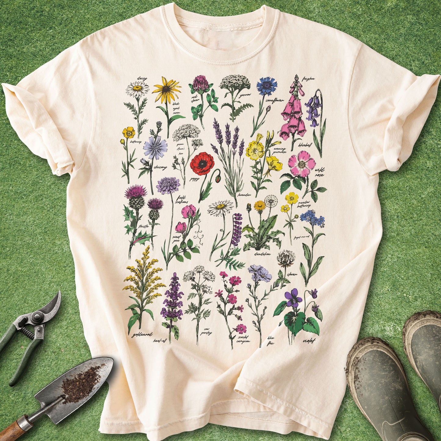 Beige t-shirt with floral design on a green background