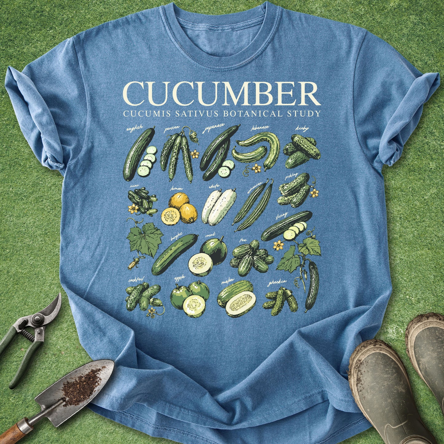 Blue t-shirt with cucumber illustrations on a green background