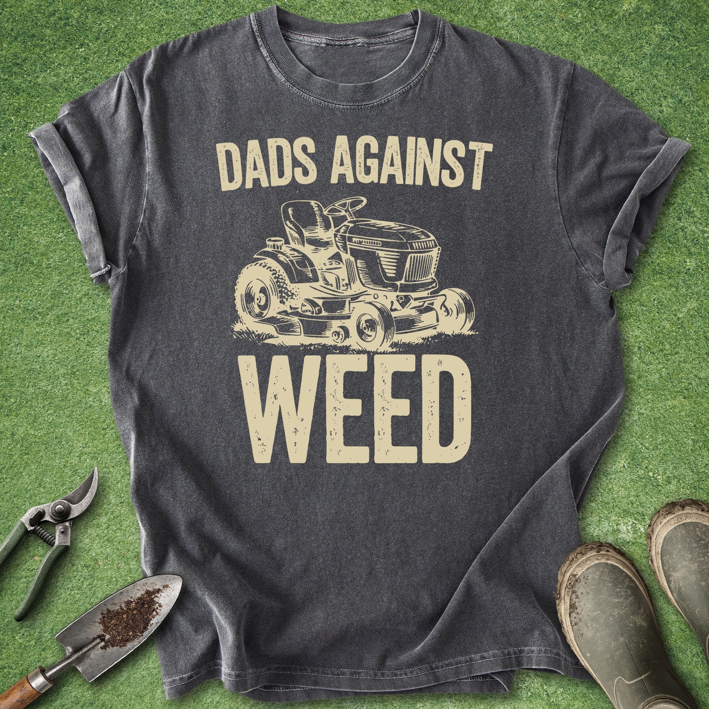 Gray t-shirt with 'Dads Against Weed' graphic on a green grass background