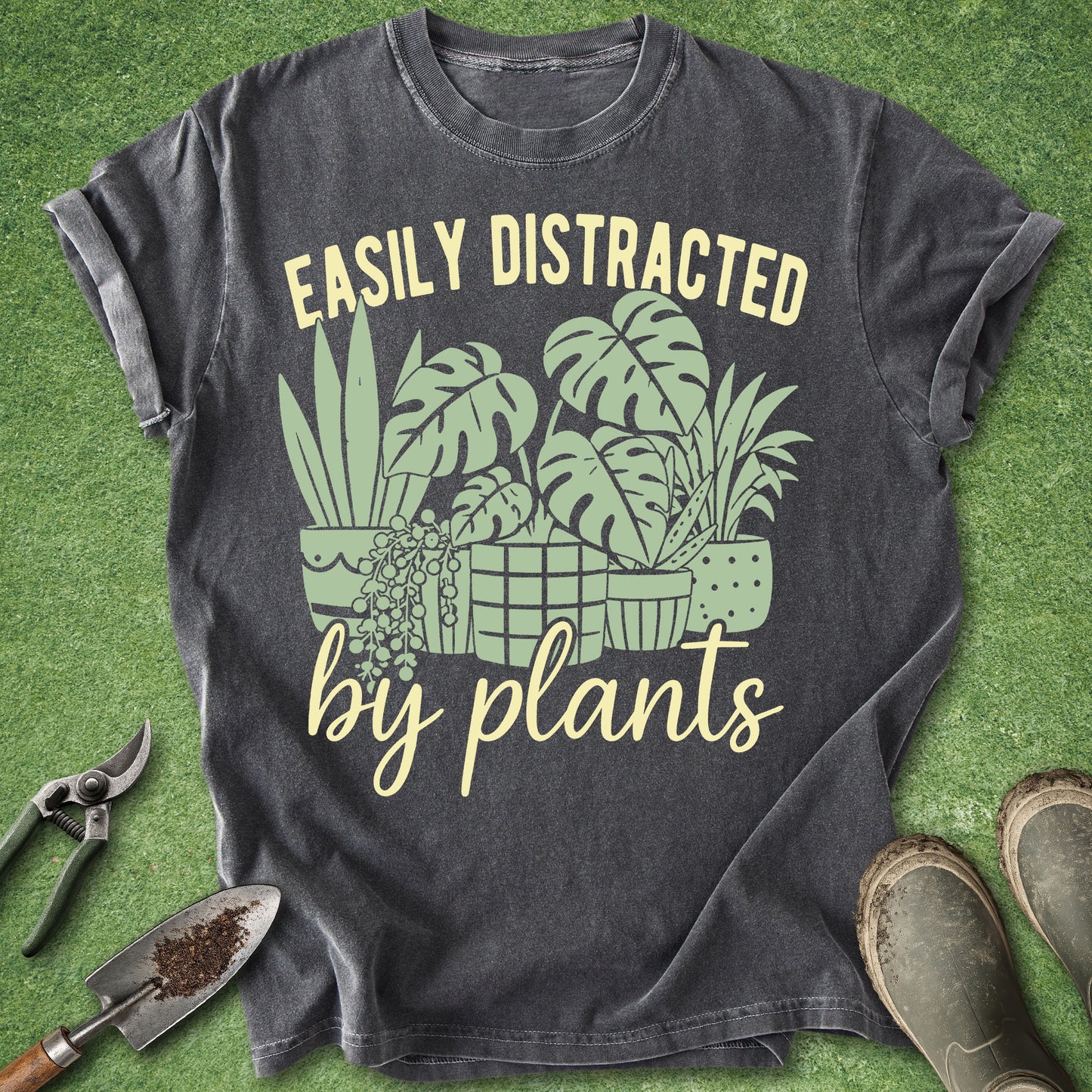 Funny plant lover t-shirt with houseplant illustration and “Easily Distracted By Plants” quote on pepper gray shirt