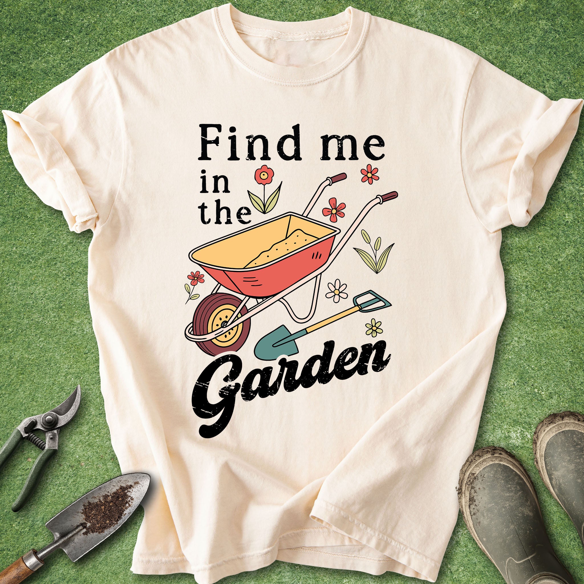 White t-shirt with gardening-themed design on a green background