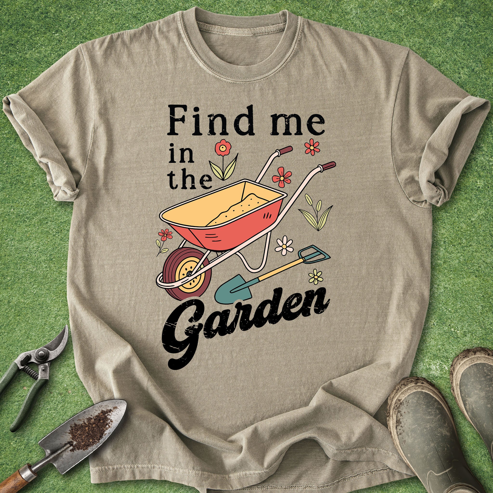 Beige t-shirt with gardening graphic and text on a green grass background