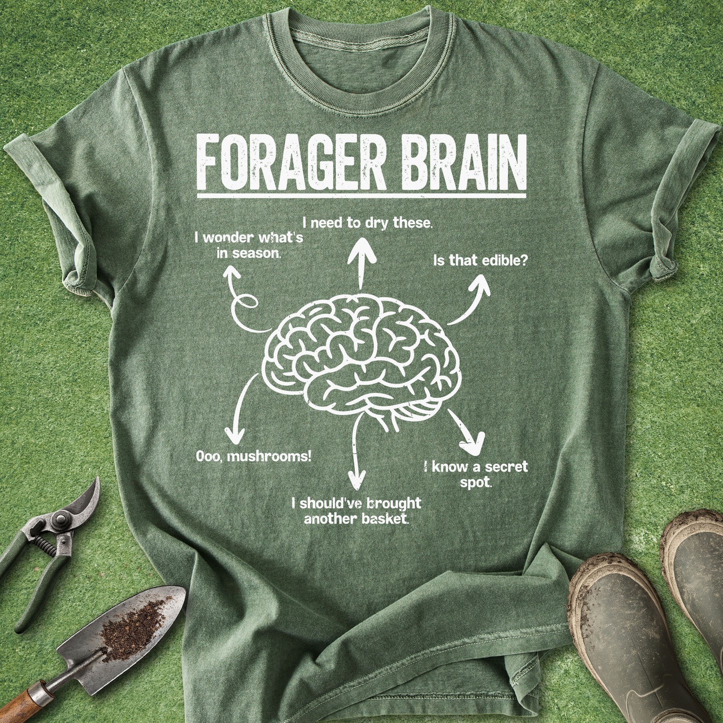 Green t-shirt with 'Forager Brain' graphic on a grass background