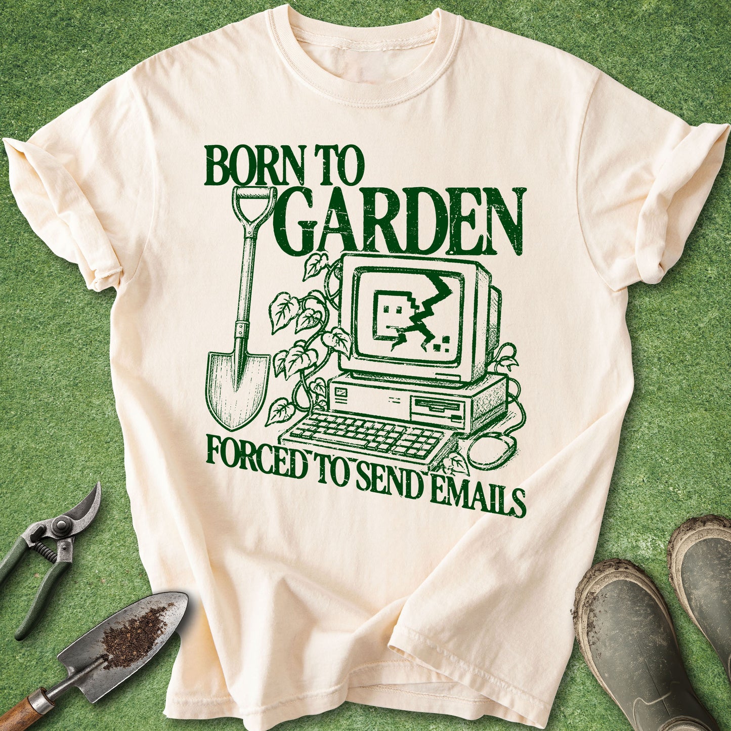 Vintage-inspired design reading "Born to Garden Forced to Send Emails" featuring a retro computer with a cracked screen, a garden shovel, and climbing vines for gardeners and plant lovers.