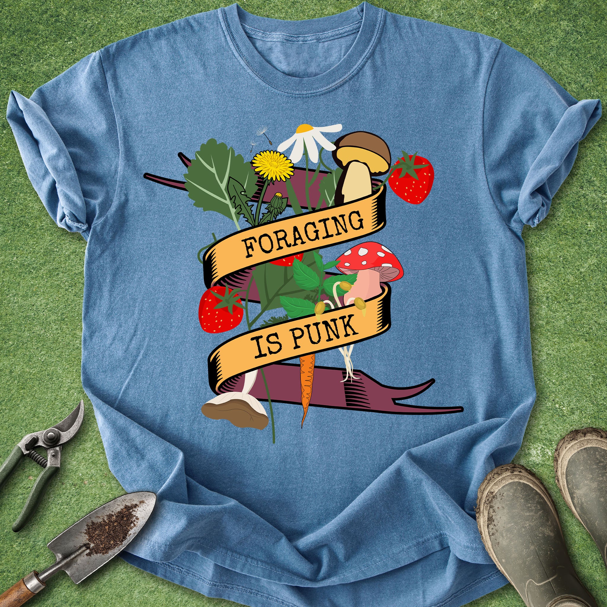 Blue t-shirt with 'Foraging is Punk' graphic on a green background