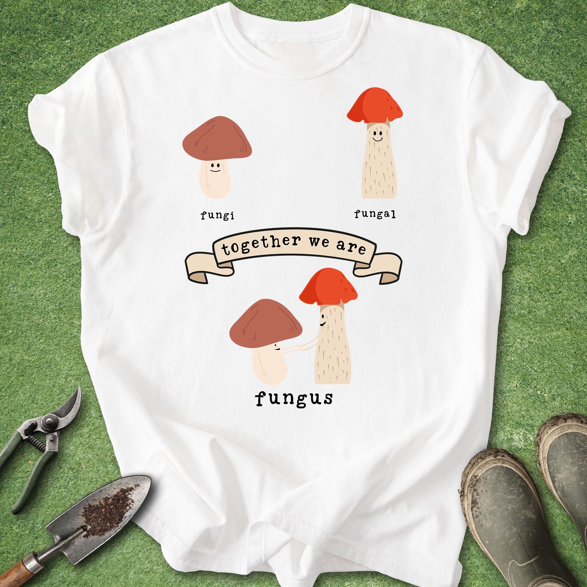 White t-shirt with mushroom design and text on a green background