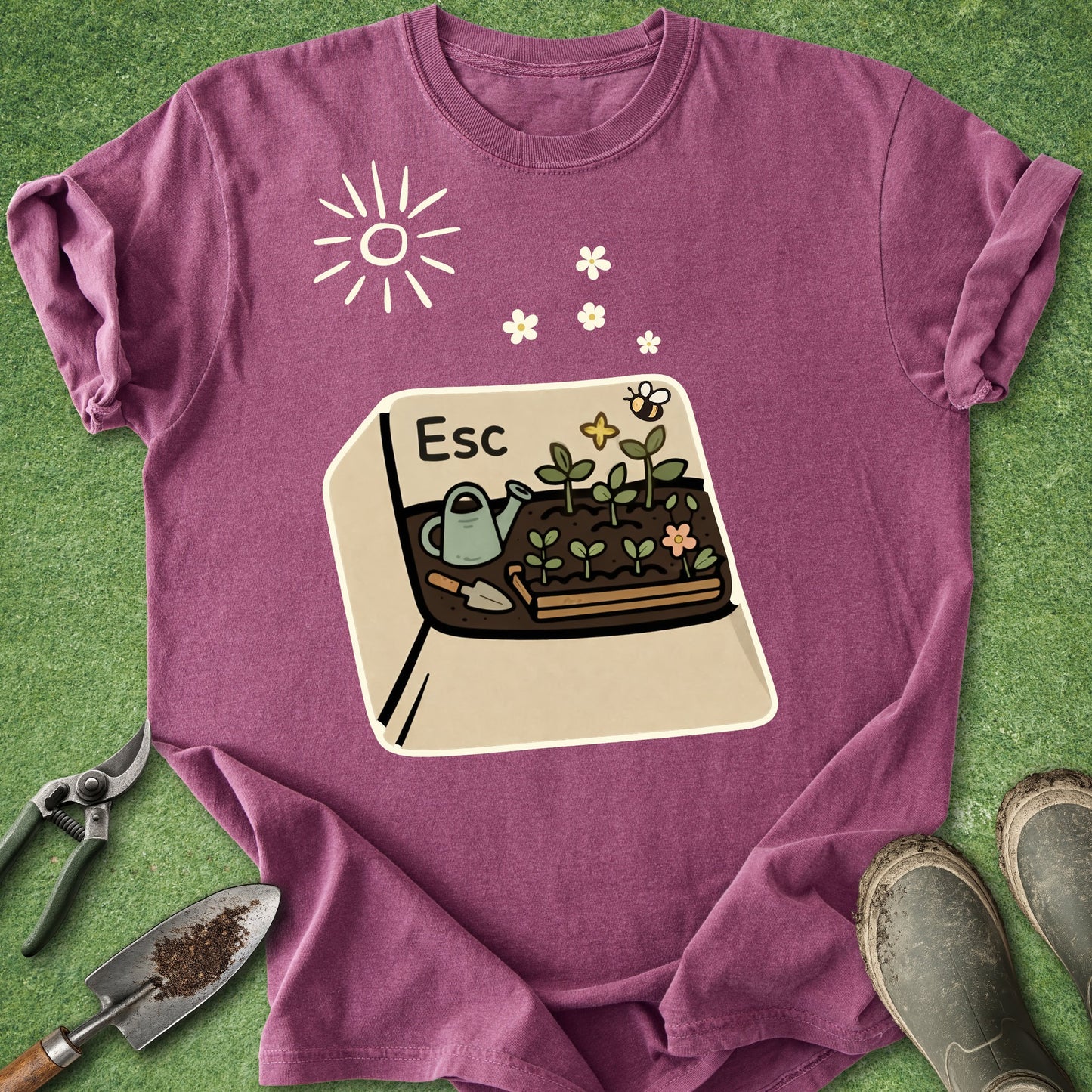 Purple t-shirt with a gardening graphic on a green grass background