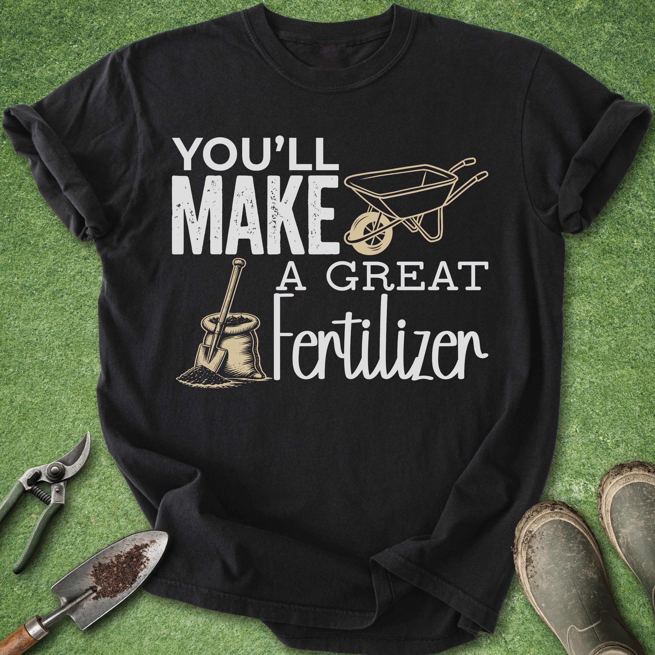 Black t-shirt with gardening-themed text and graphics on a green background