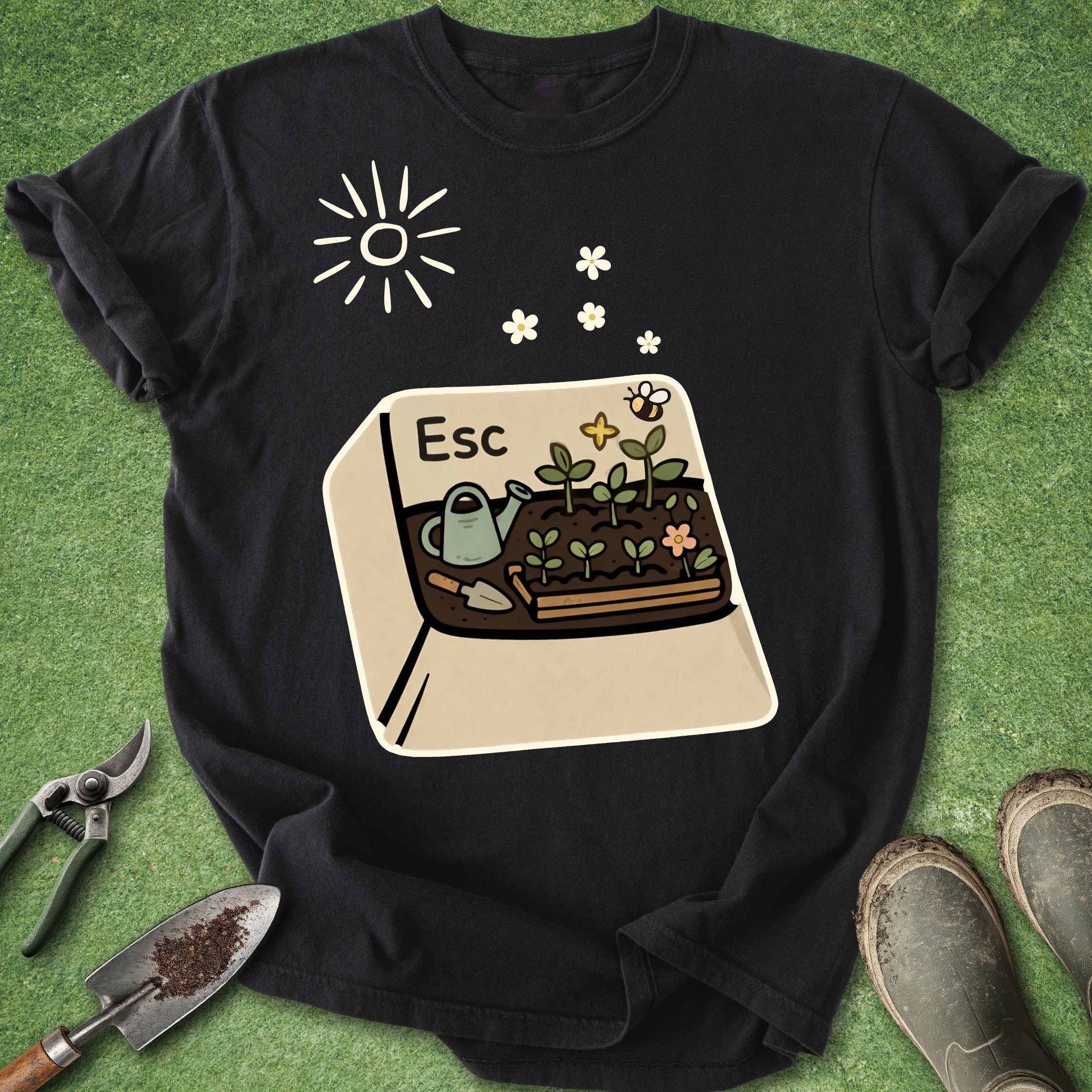 Black t-shirt with a gardening graphic on a green grass background