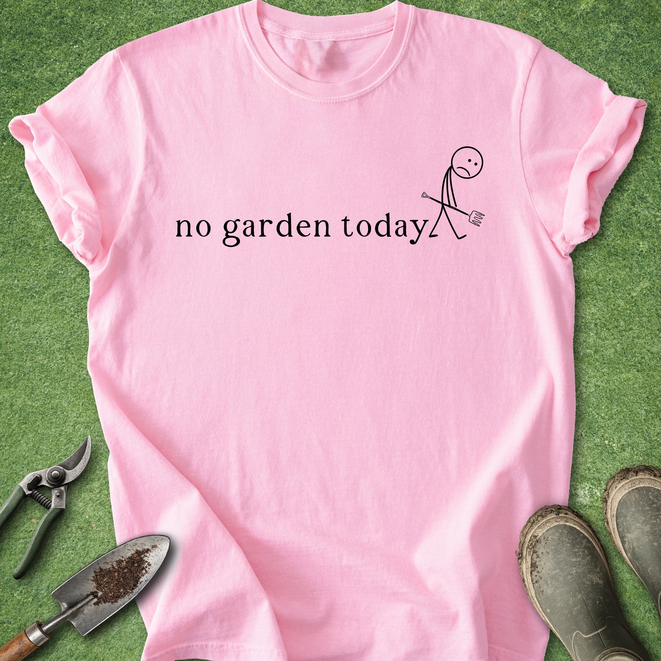 Pink t-shirt with 'no garden today' text and stick figure on grass with gardening tools.