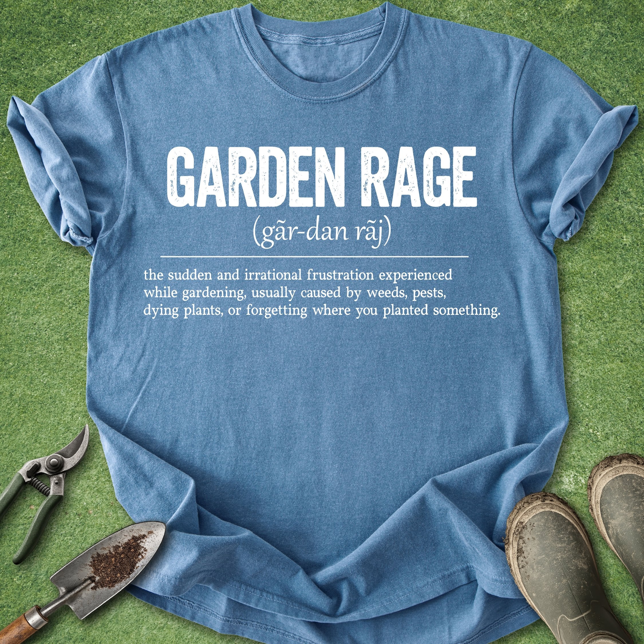 Blue t-shirt with 'Garden Rage' definition on a grass background