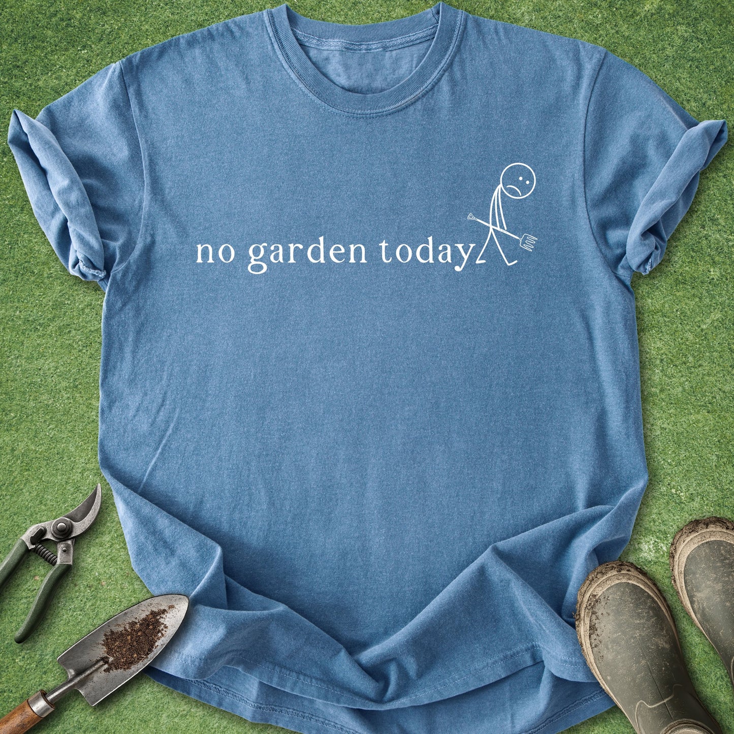 Blue t-shirt with 'no garden today' text and graphic on a grass background