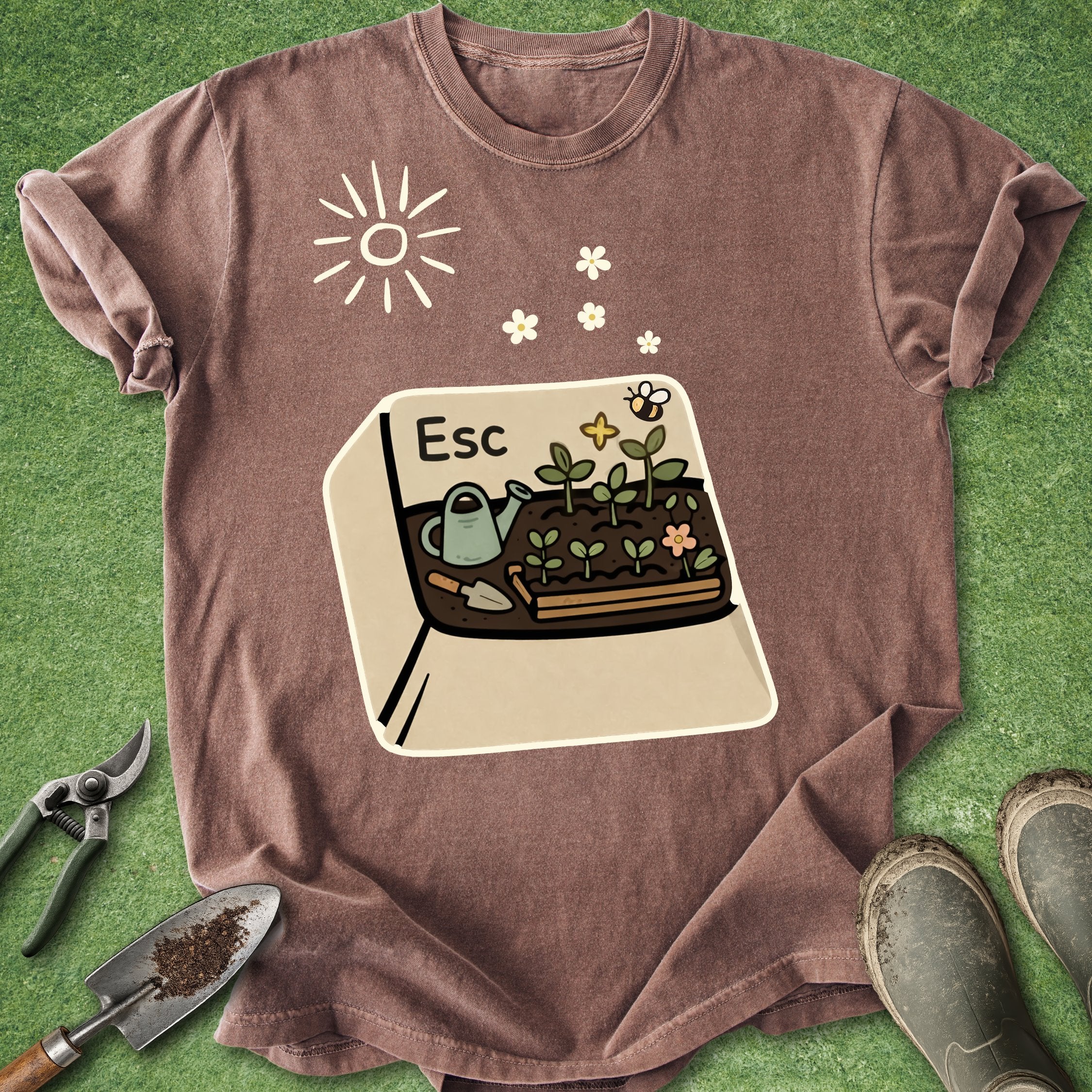 Brown t-shirt with a graphic of a garden on a green background