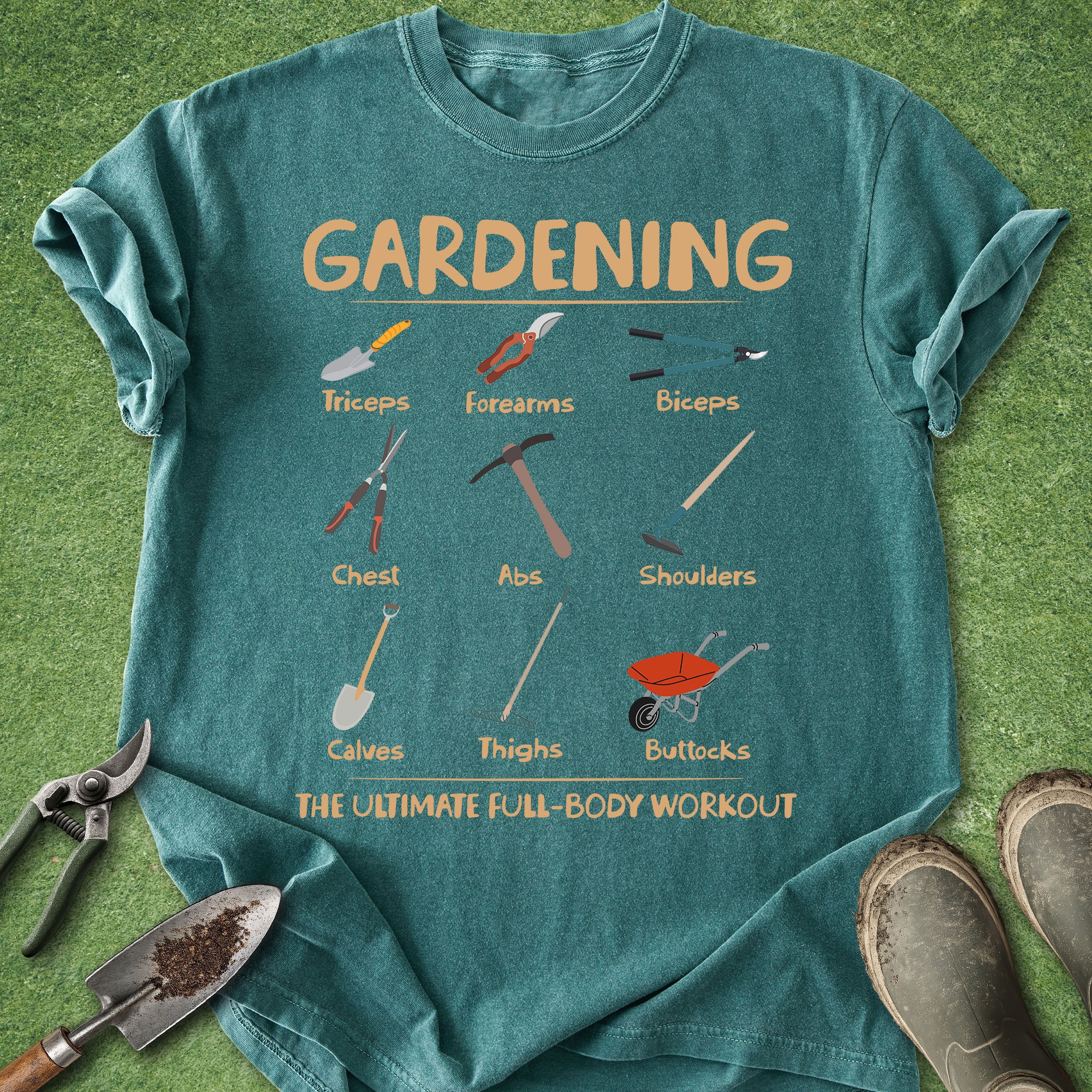 Teal t-shirt with gardening tool illustrations on a grass background