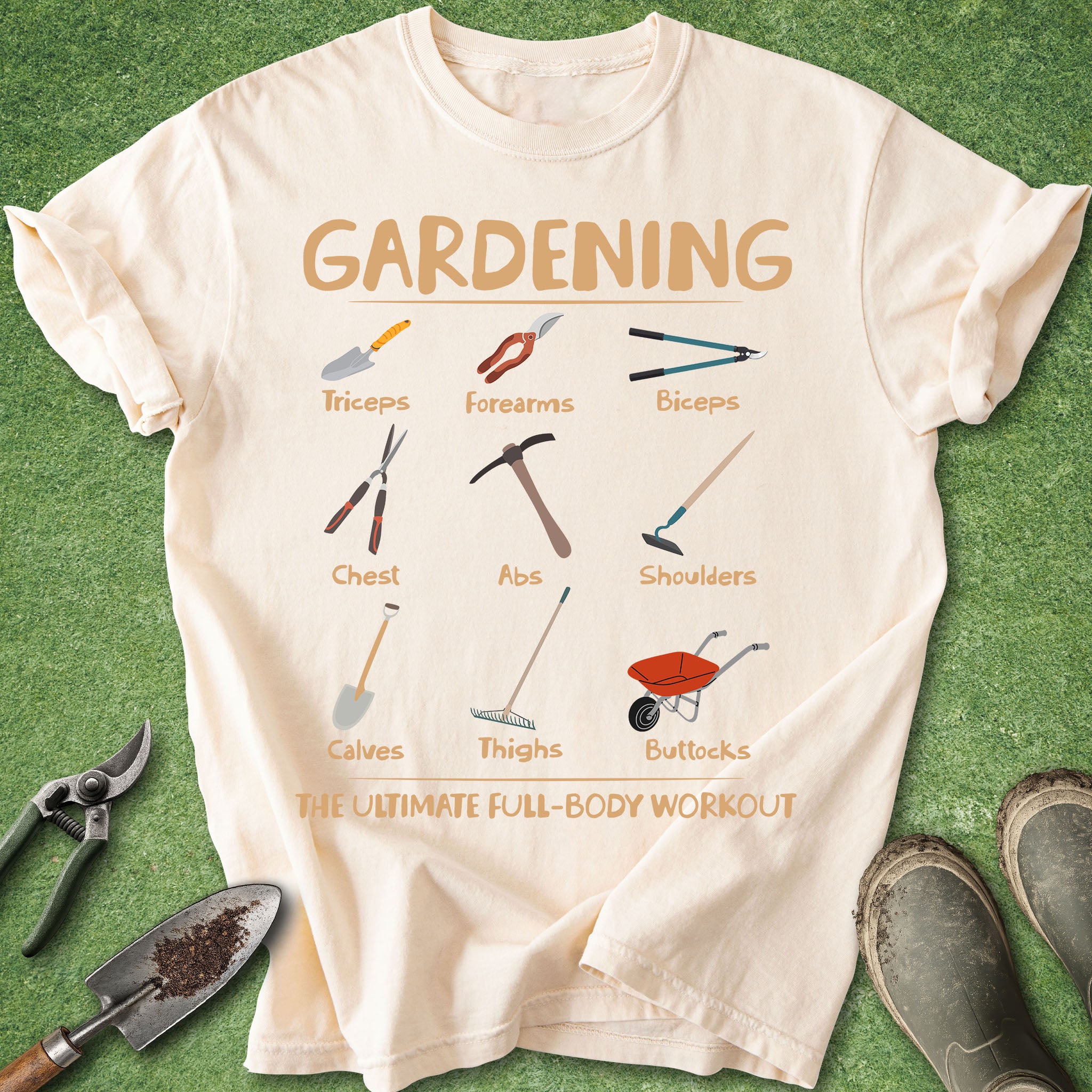 Beige t-shirt with gardening tool illustrations and text on a green grass background