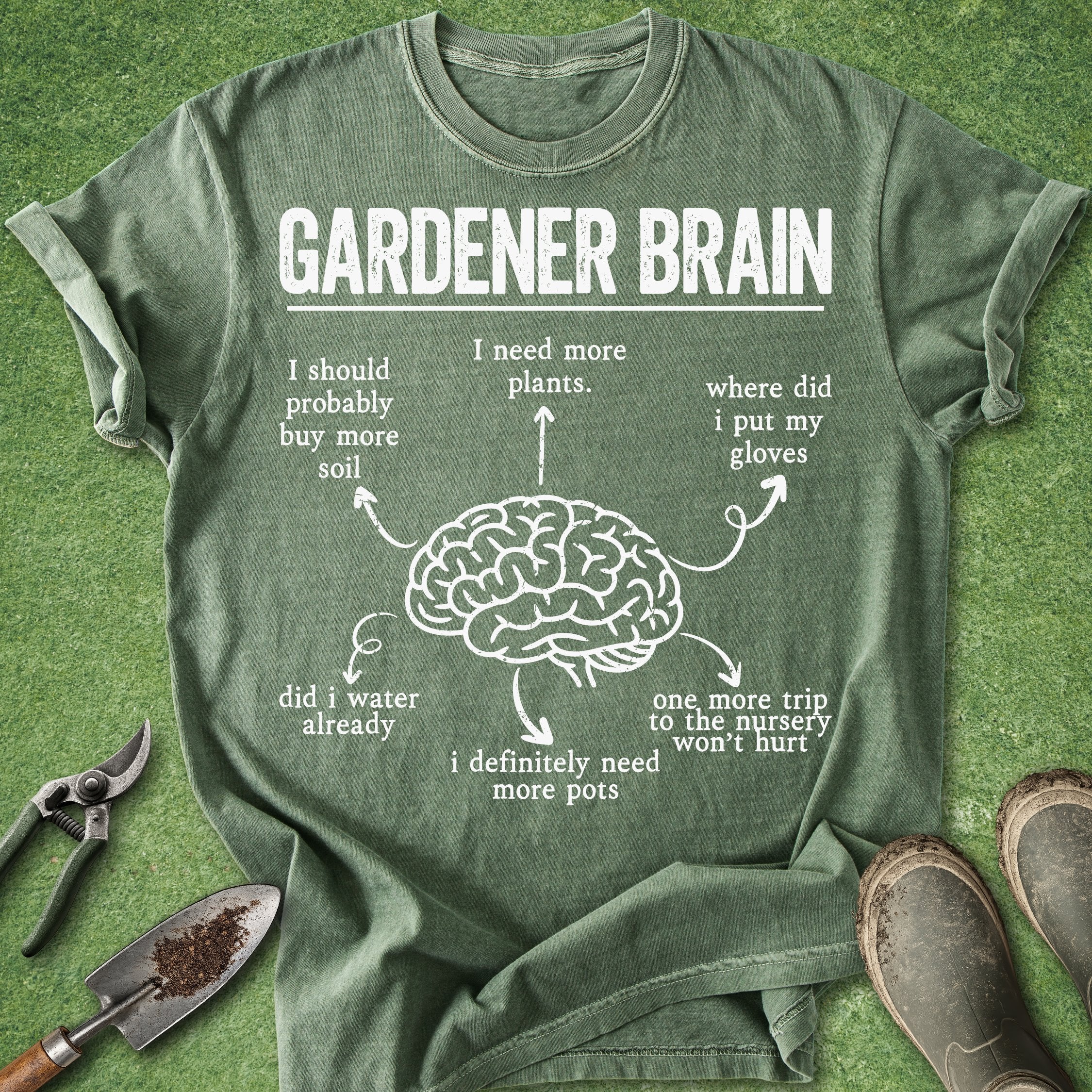 Green t-shirt with 'Gardener Brain' graphic and text on a grass background