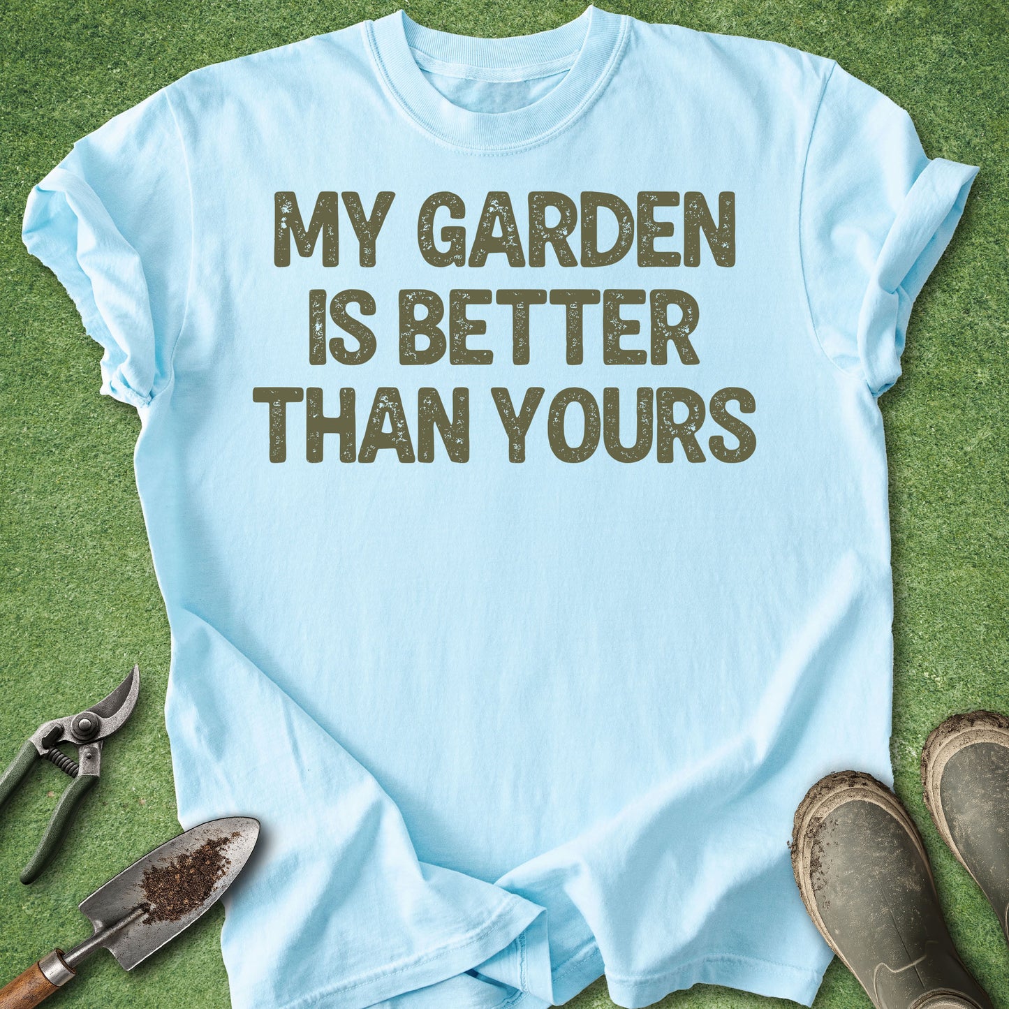 Light blue t-shirt with 'My garden is better than yours' text on a grass background.