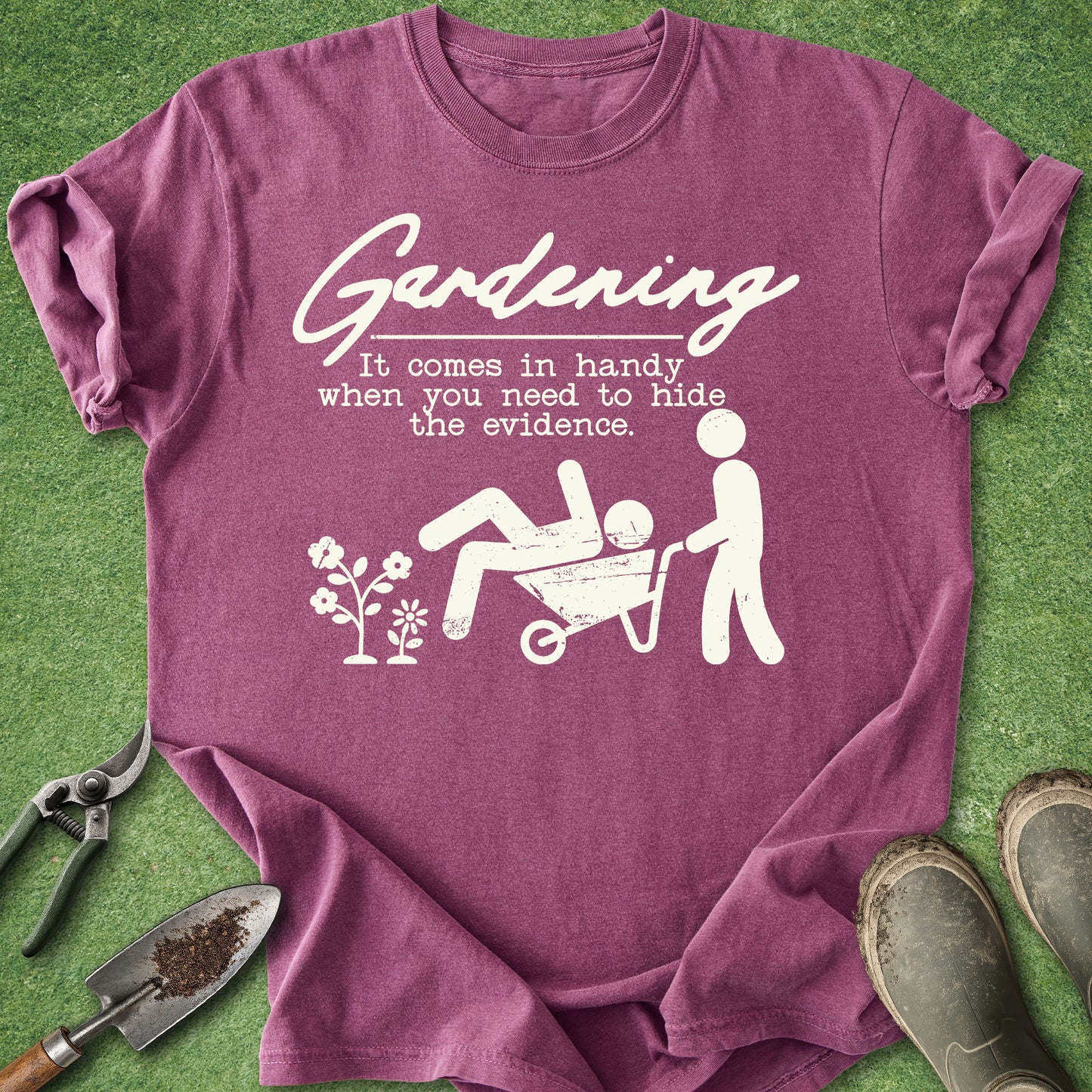 Purple t-shirt with white graphic and text on a grass background