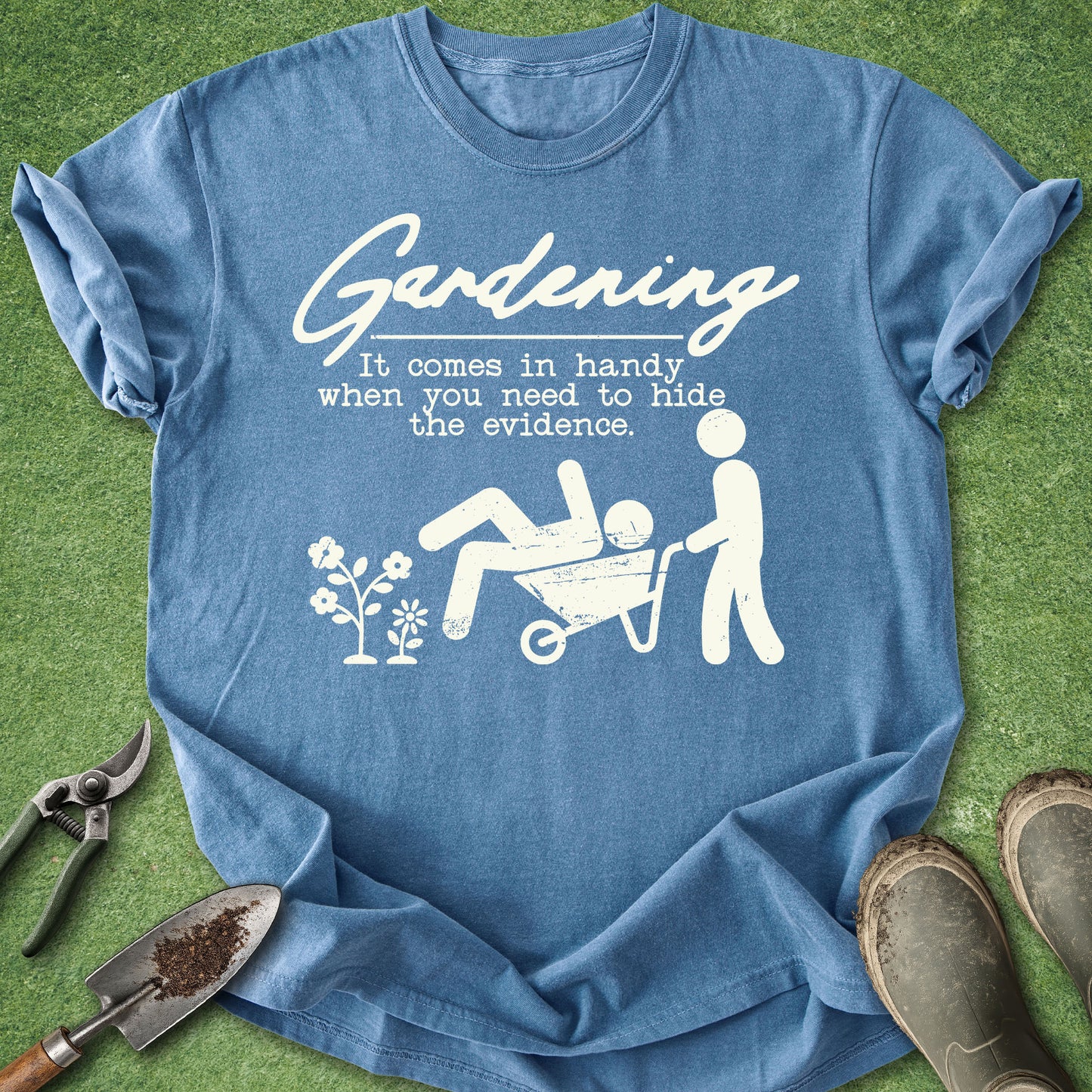 Blue t-shirt with white graphic and text on a green background