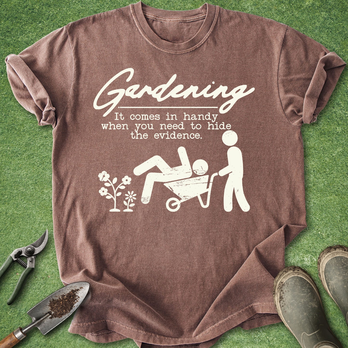 Brown t-shirt with white graphic and text on a green grass background