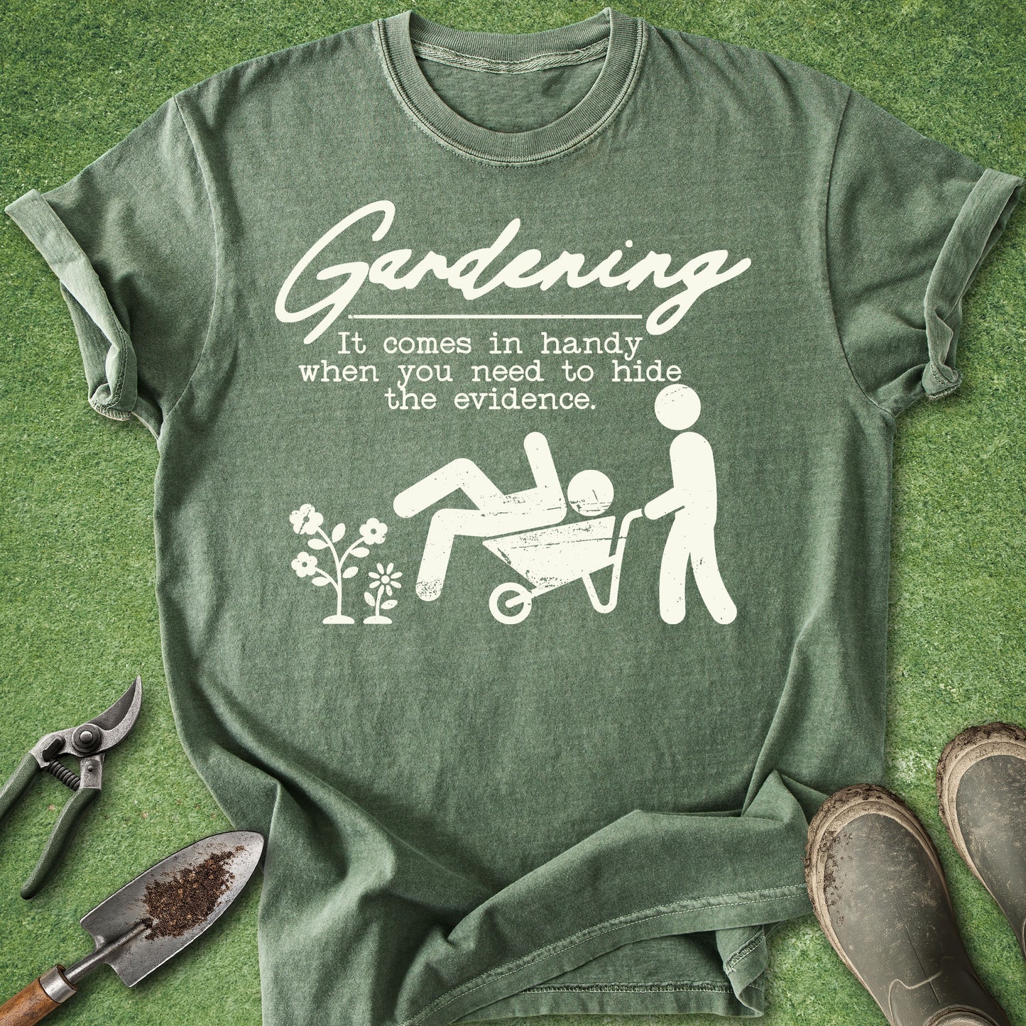 Green t-shirt with white graphic and text on a grass background