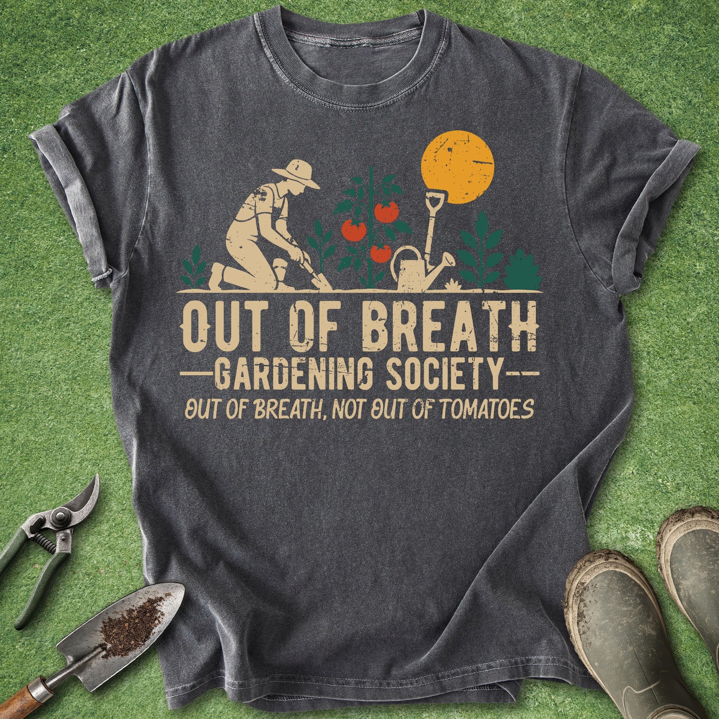 Gray t-shirt with gardening graphic and text on a green grass background