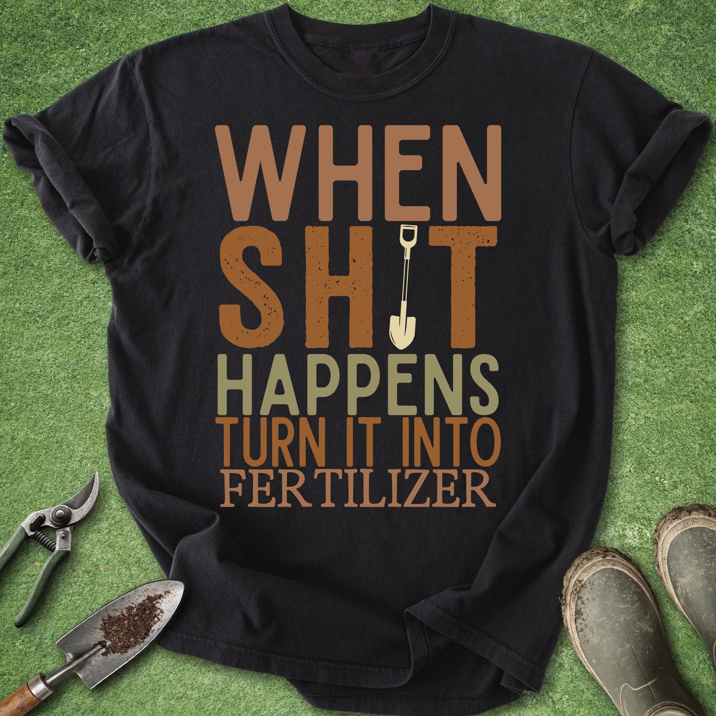 Black t-shirt with humorous text on a green background with gardening tools.