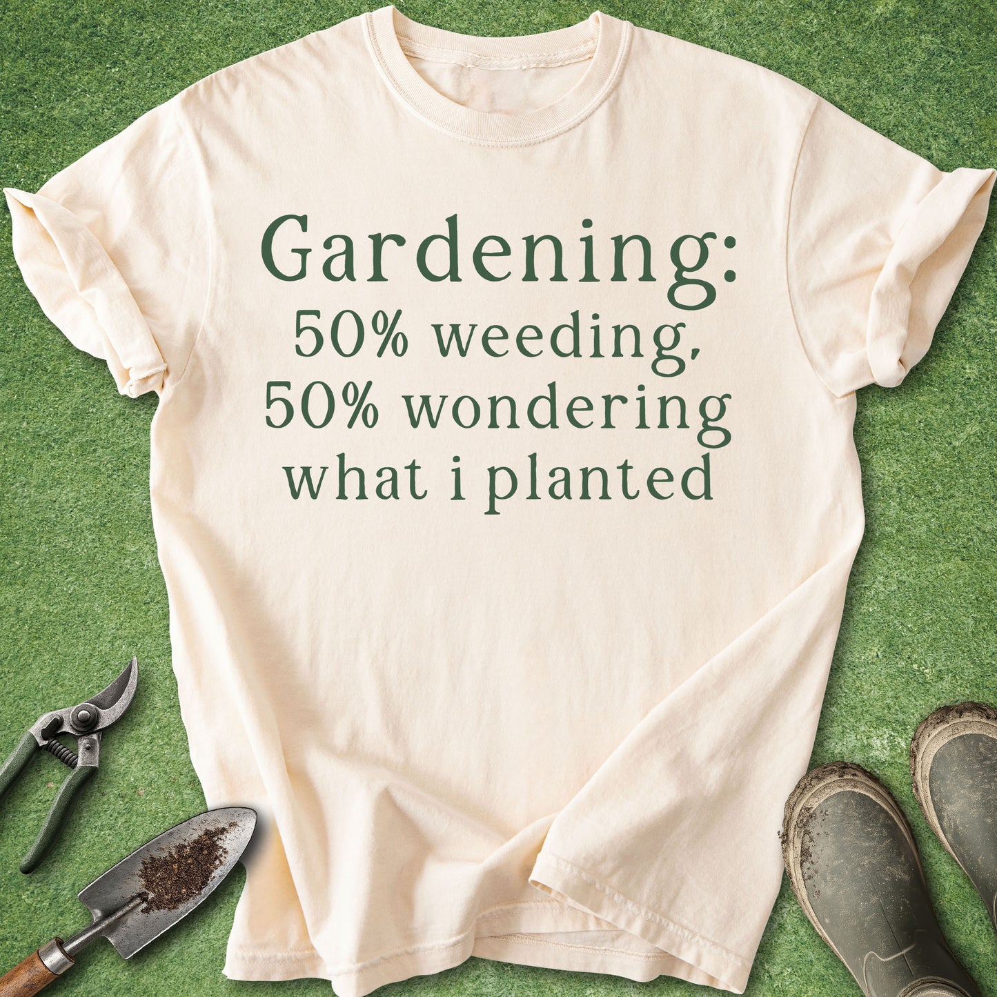 Beige t-shirt with gardening text on a green background with gardening tools.