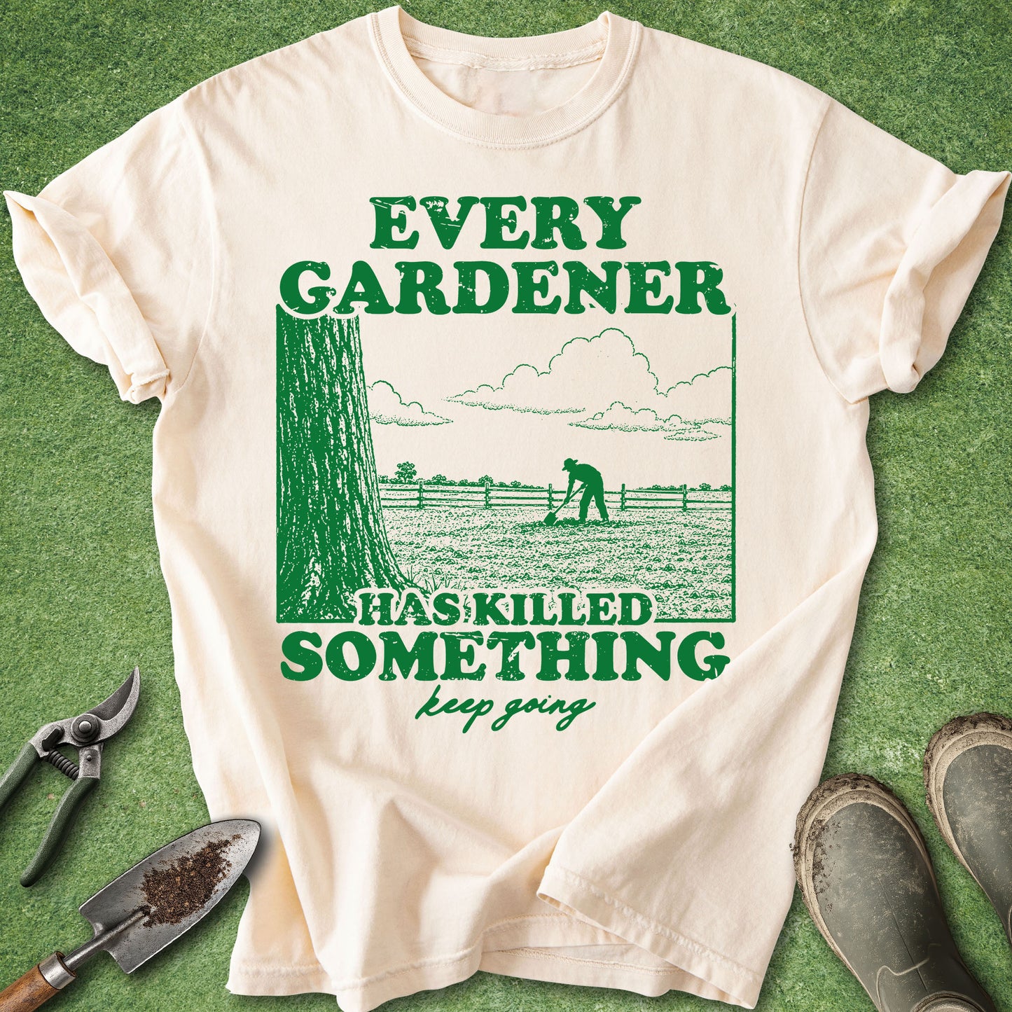 Comfort Colors Ivory t-shirt featuring the quote "Every Gardener Has Killed Something, Keep Going" with a vintage-style illustration of a gardener working in a field.