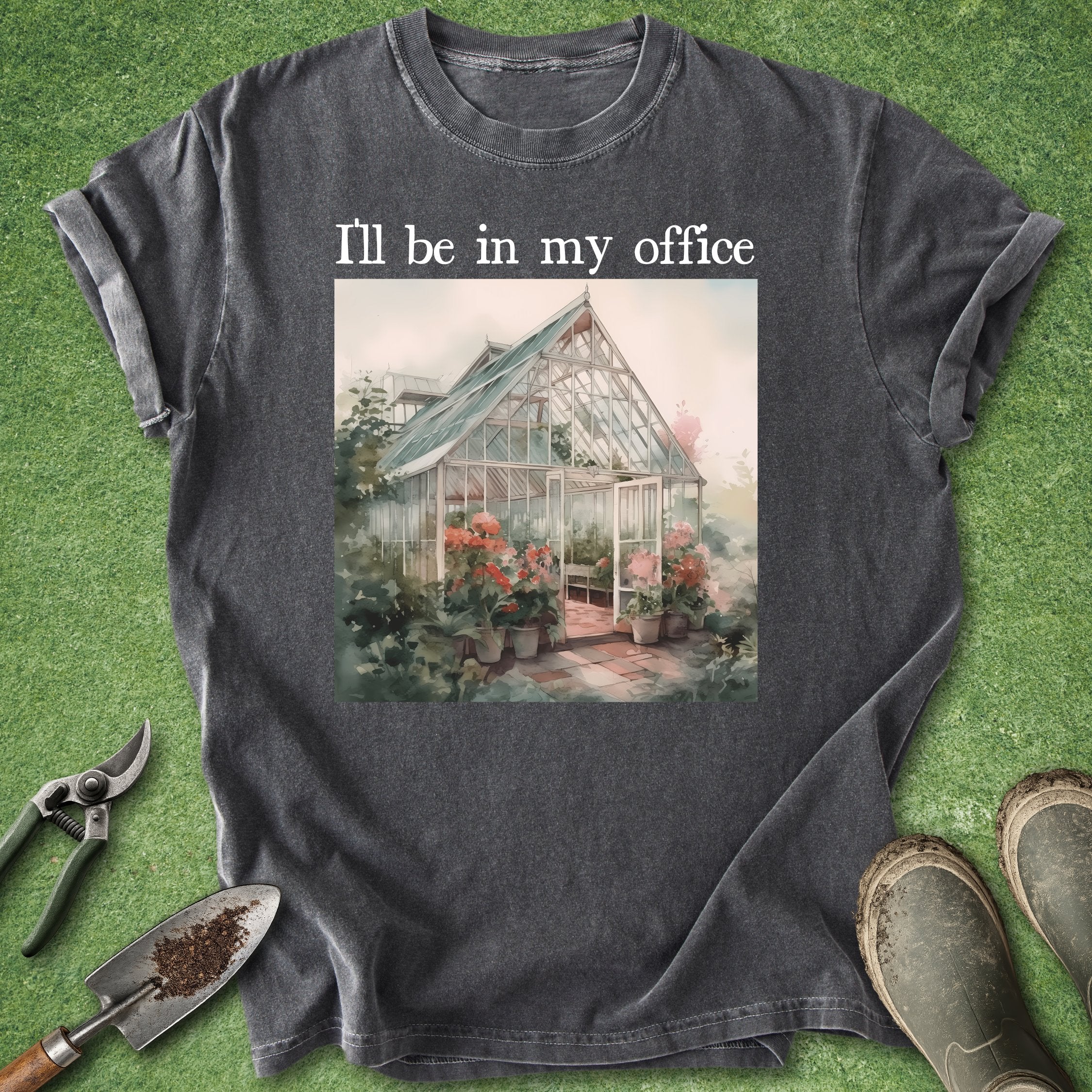 Black t-shirt with a greenhouse graphic and text 'I'll be in my office' on a grass background.