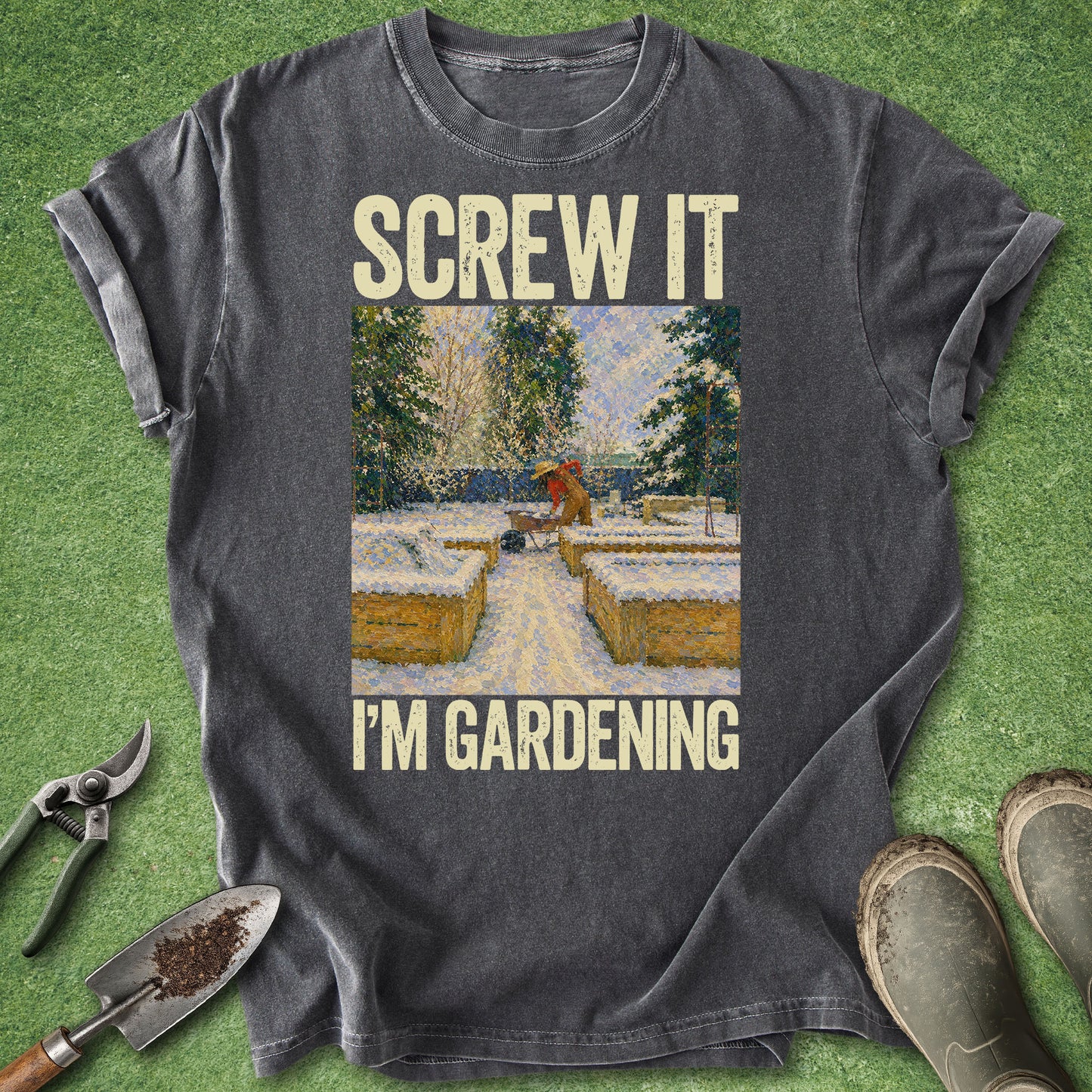 Gray t-shirt with 'Screw it, I'm gardening' graphic on a grass background