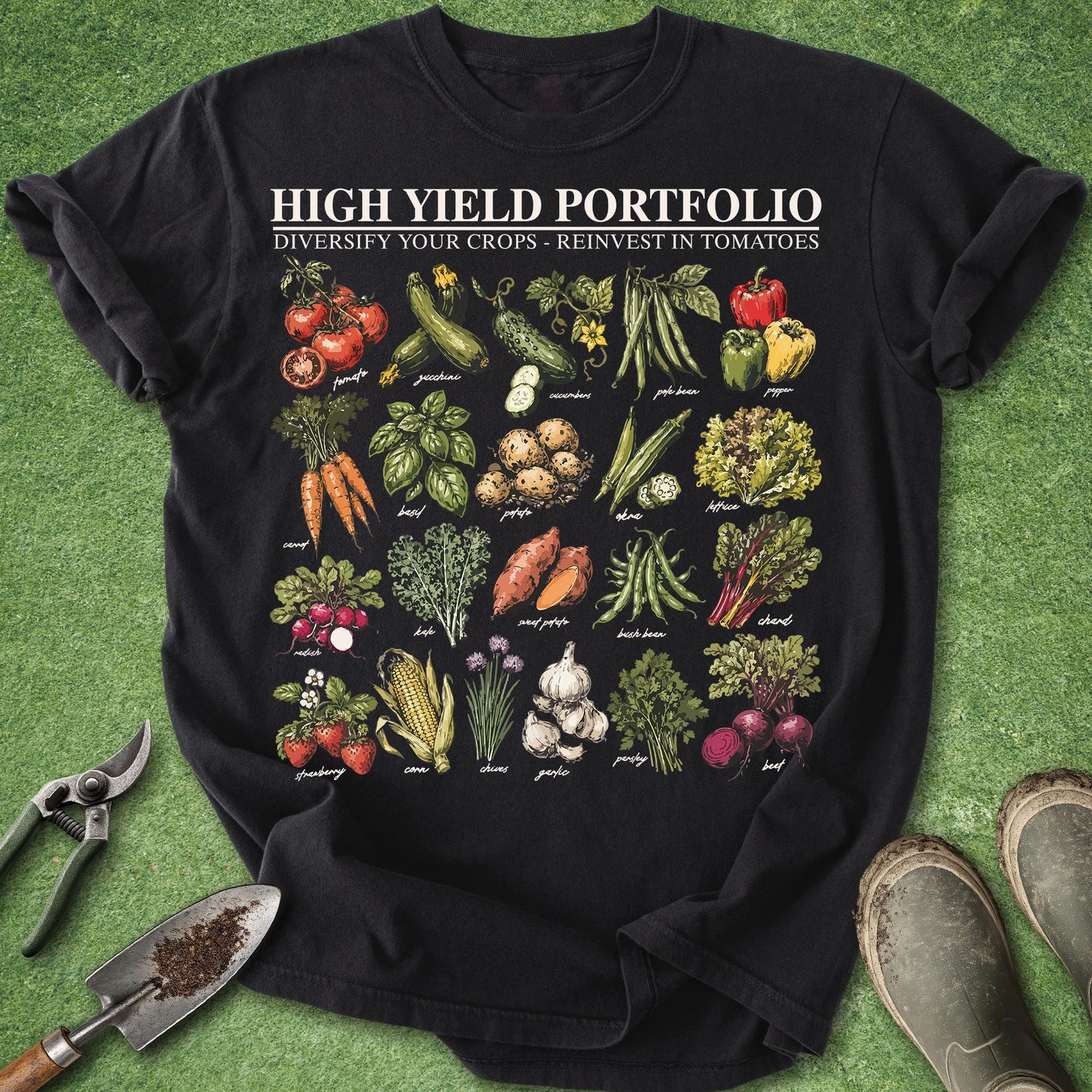 Black Comfort Colors t-shirt featuring the phrase "High Yield Portfolio – Diversify Your Crops, Reinvest in Tomatoes" with illustrated vegetables including tomatoes, zucchini, cucumbers, peppers, beans, carrots, potatoes, lettuce, garlic, beets, corn, parsley, and sweet potatoes.