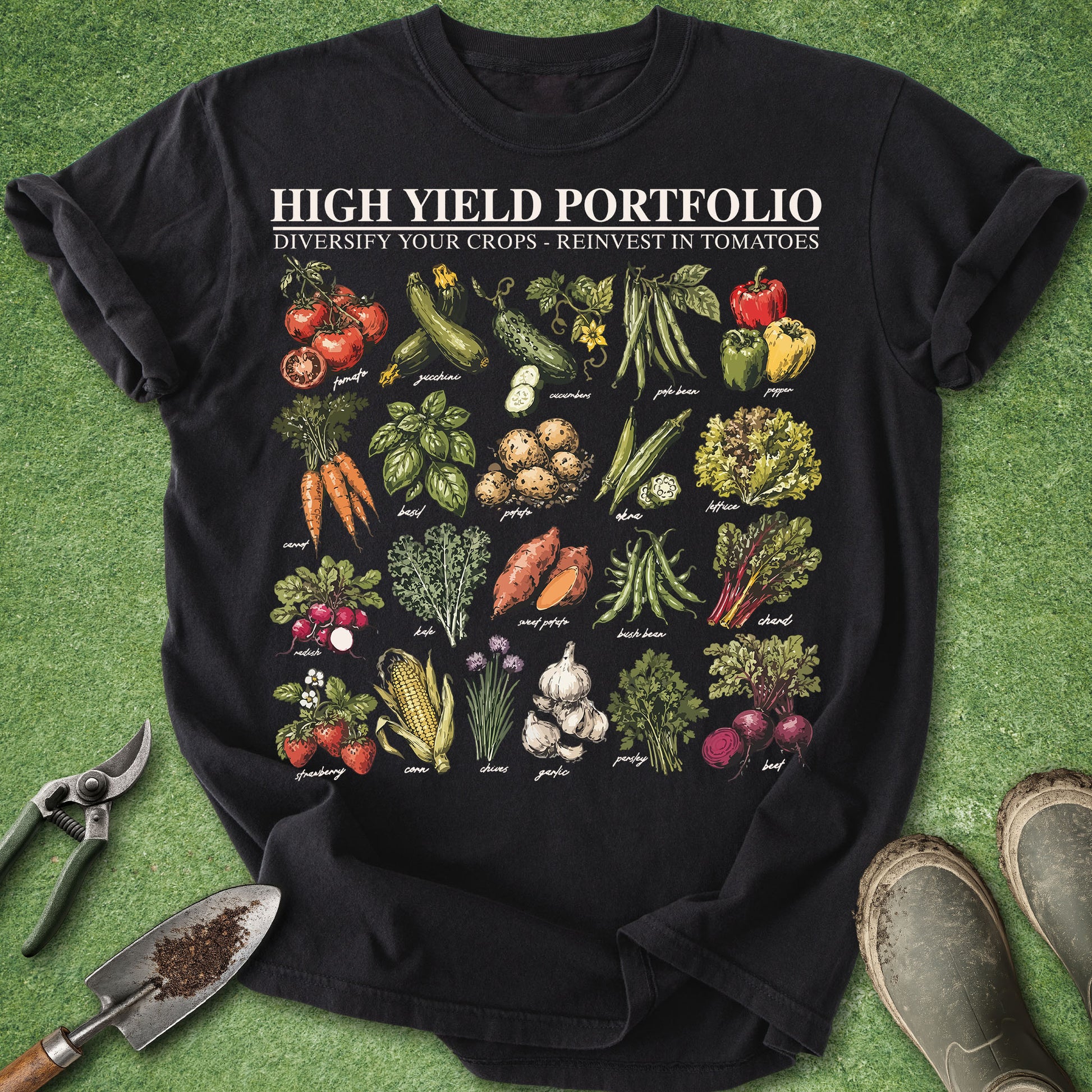 Black Comfort Colors t-shirt featuring the phrase "High Yield Portfolio – Diversify Your Crops, Reinvest in Tomatoes" with illustrated vegetables including tomatoes, zucchini, cucumbers, peppers, beans, carrots, potatoes, lettuce, garlic, beets, corn, parsley, and sweet potatoes.